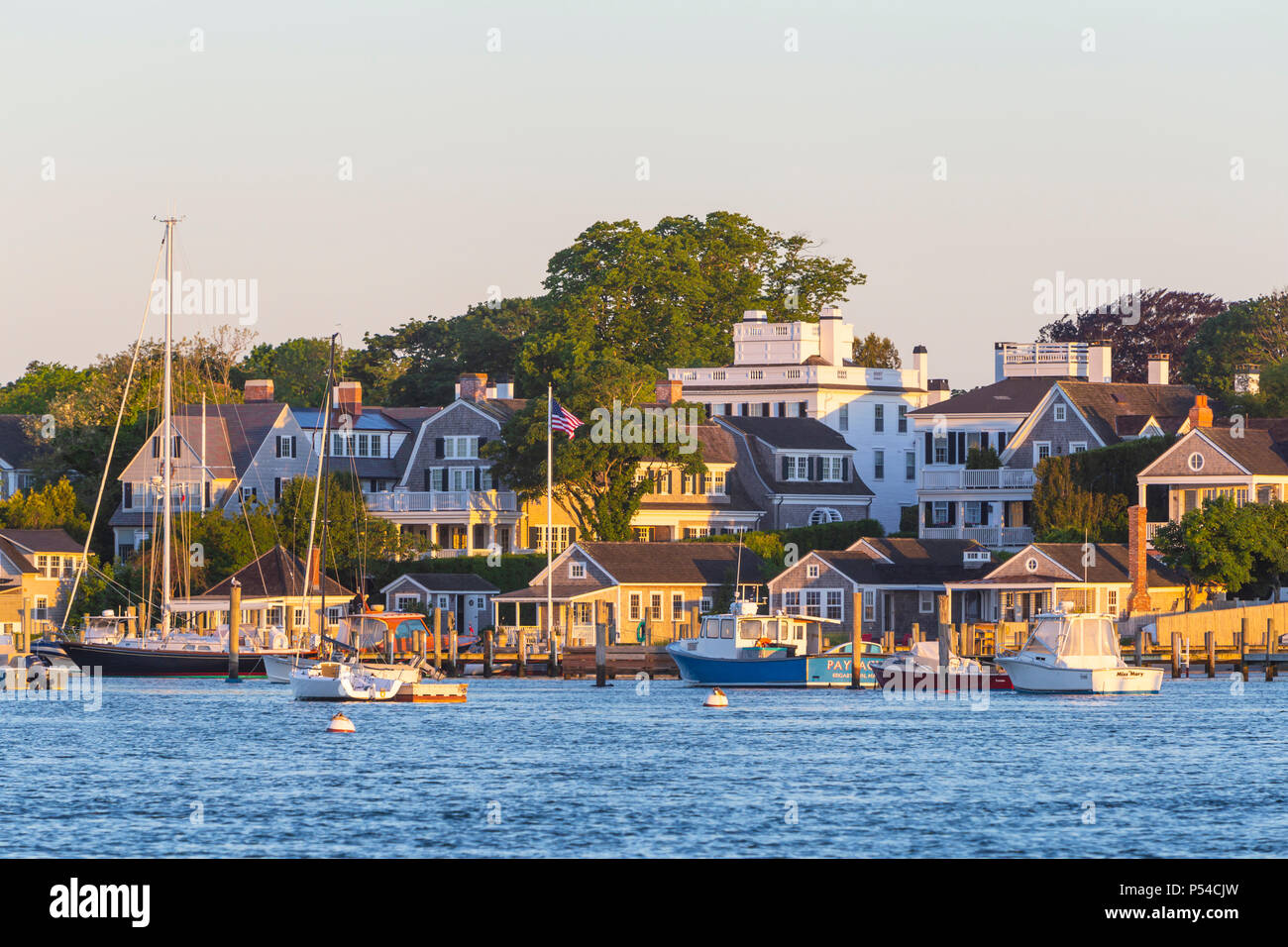 Boats moored and docked in the harbor, overlooked by stately sea
