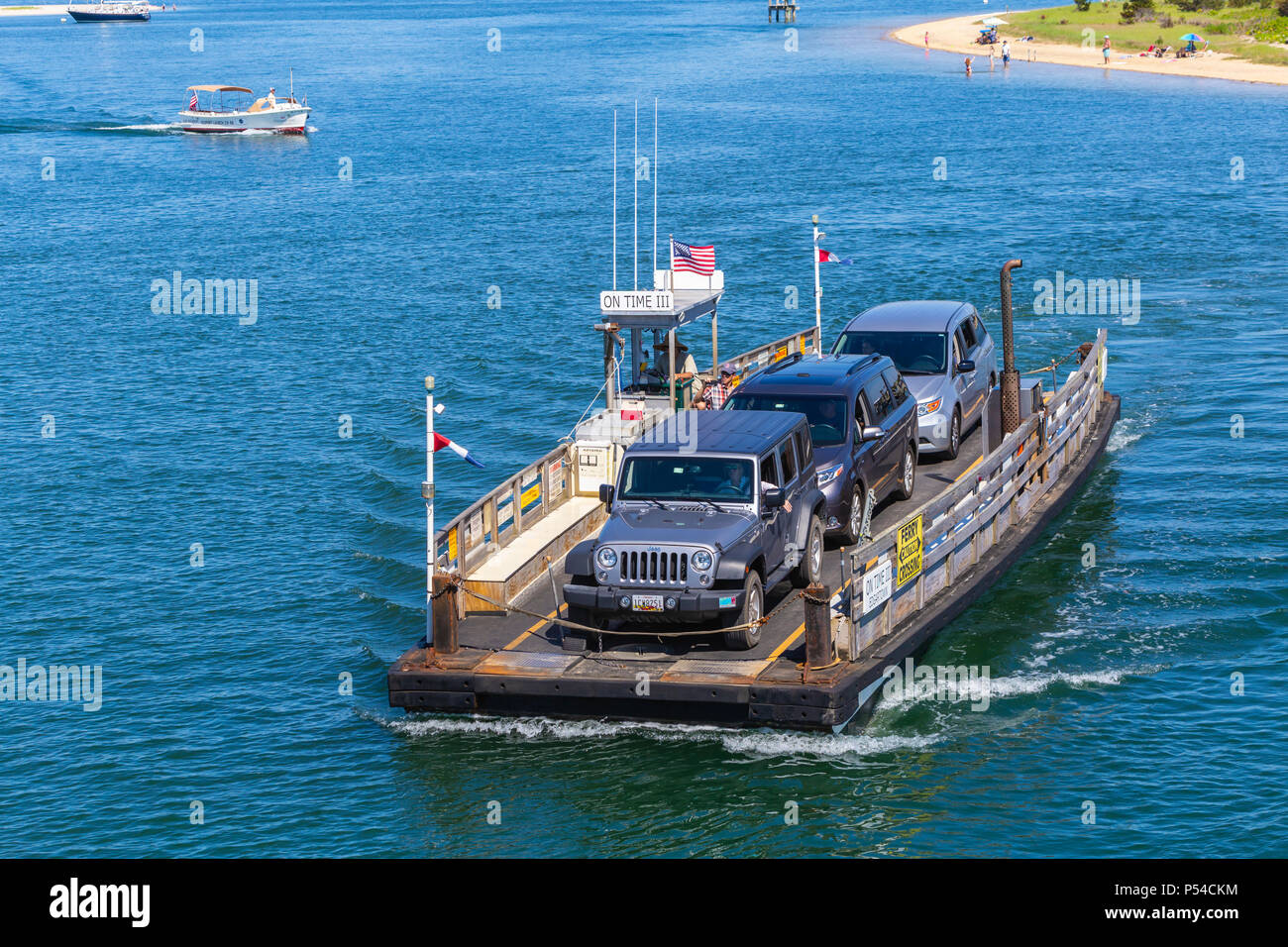 Chappy Ferry 'On Time III' arrives with cars and passengers from Chappaquiddick Island in Edgartown, Massachusetts on Martha's Vineyard. Stock Photo
