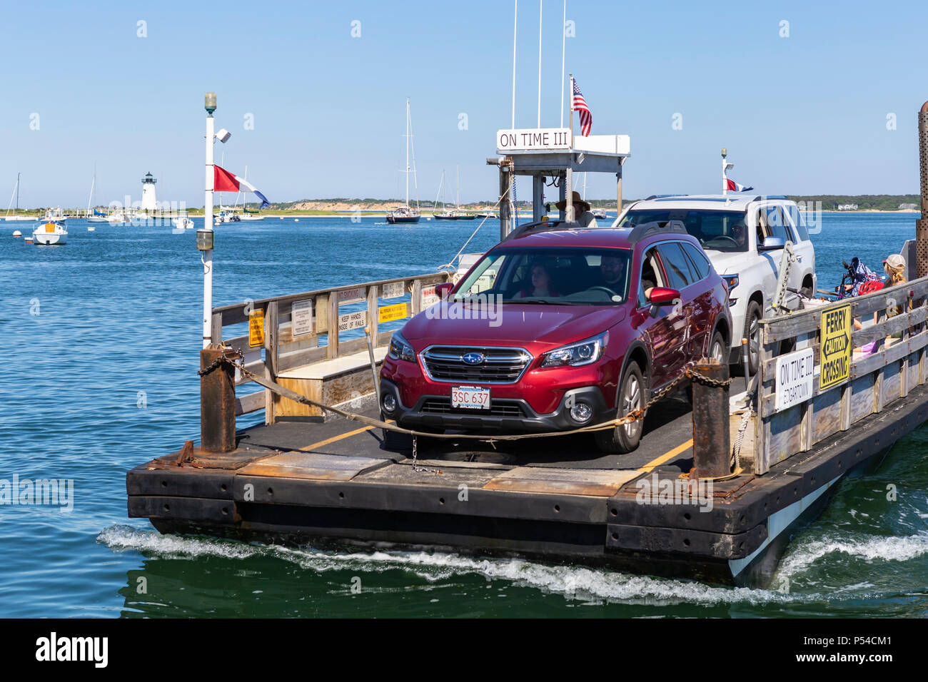 Chappy Ferry 'On Time III' arrives with cars and passengers from Chappaquiddick Island in Edgartown, Massachusetts on Martha's Vineyard. Stock Photo