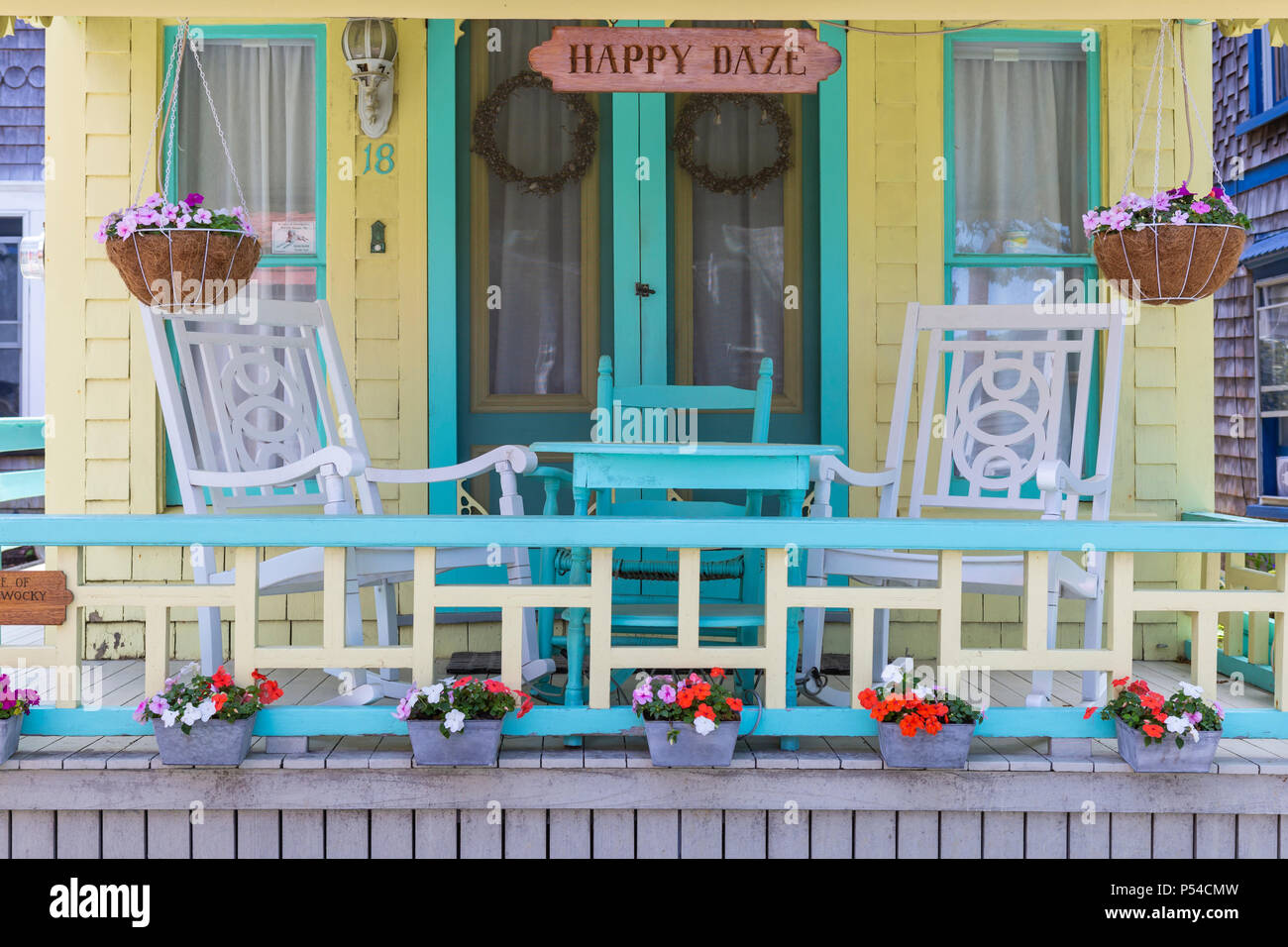 The front porch of a colorful gingerbread cottage in the Martha's Vineyard Camp Meeting Association (MVCMA) in Oak Bluffs, Massachusetts. Stock Photo