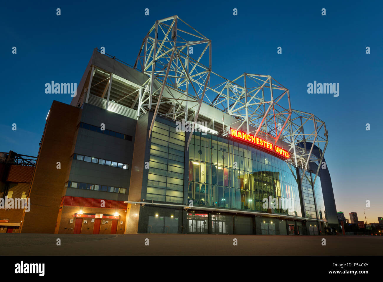 Old Trafford stadium, home of Manchester United Football Club, during a summer's evening (Editorial use only). Stock Photo