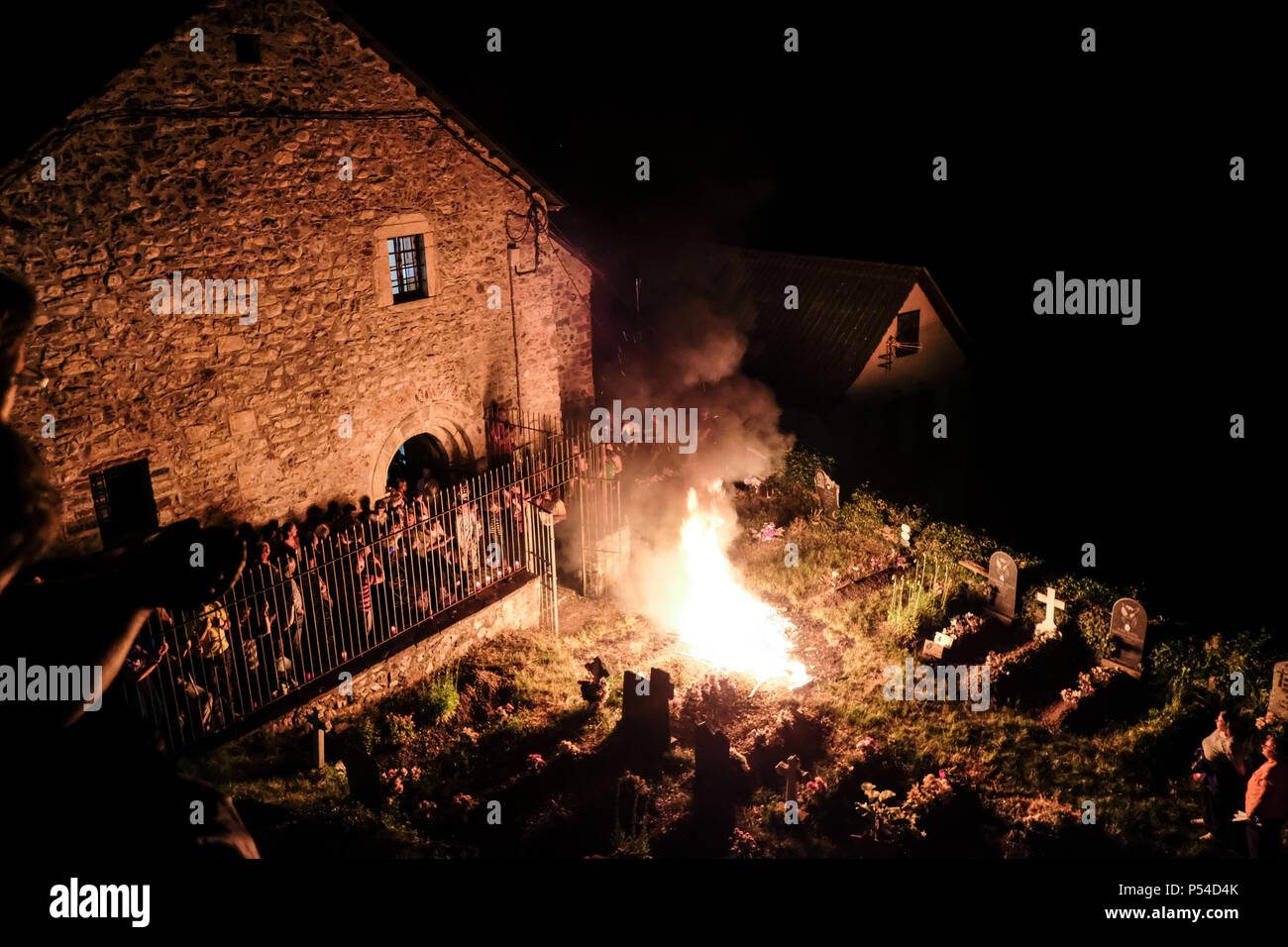 San Juan De Plan, Spain. 23rd June, 2018. Revelers celebrates San Juan Night in the small village in San Juan de Plan, Huesca, northern Spain. They light the bonfire on the mountain and descend with burning 'teas' once in the village they make a run up to the cemetery where another fire is made and the 'teas' are deposited. Feast recognized by UNESCO. Credit: Mikel Cia Da Riva/ Pacific Press/Alamy Live News Stock Photo