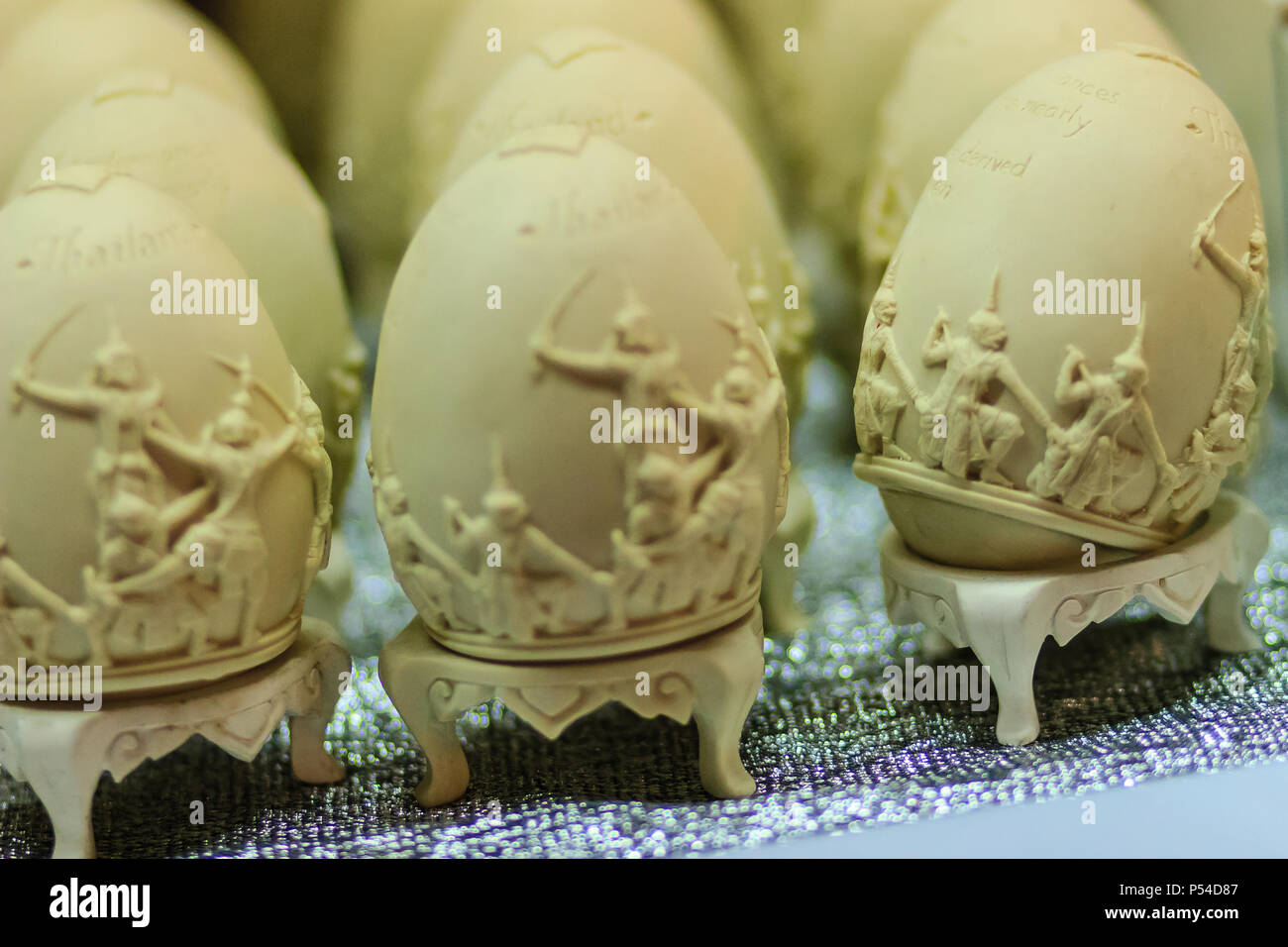 Beautiful Ester egg with Thai pattern. Handwriting inscription Happy Easter in Thai Style patterns. Stock Photo