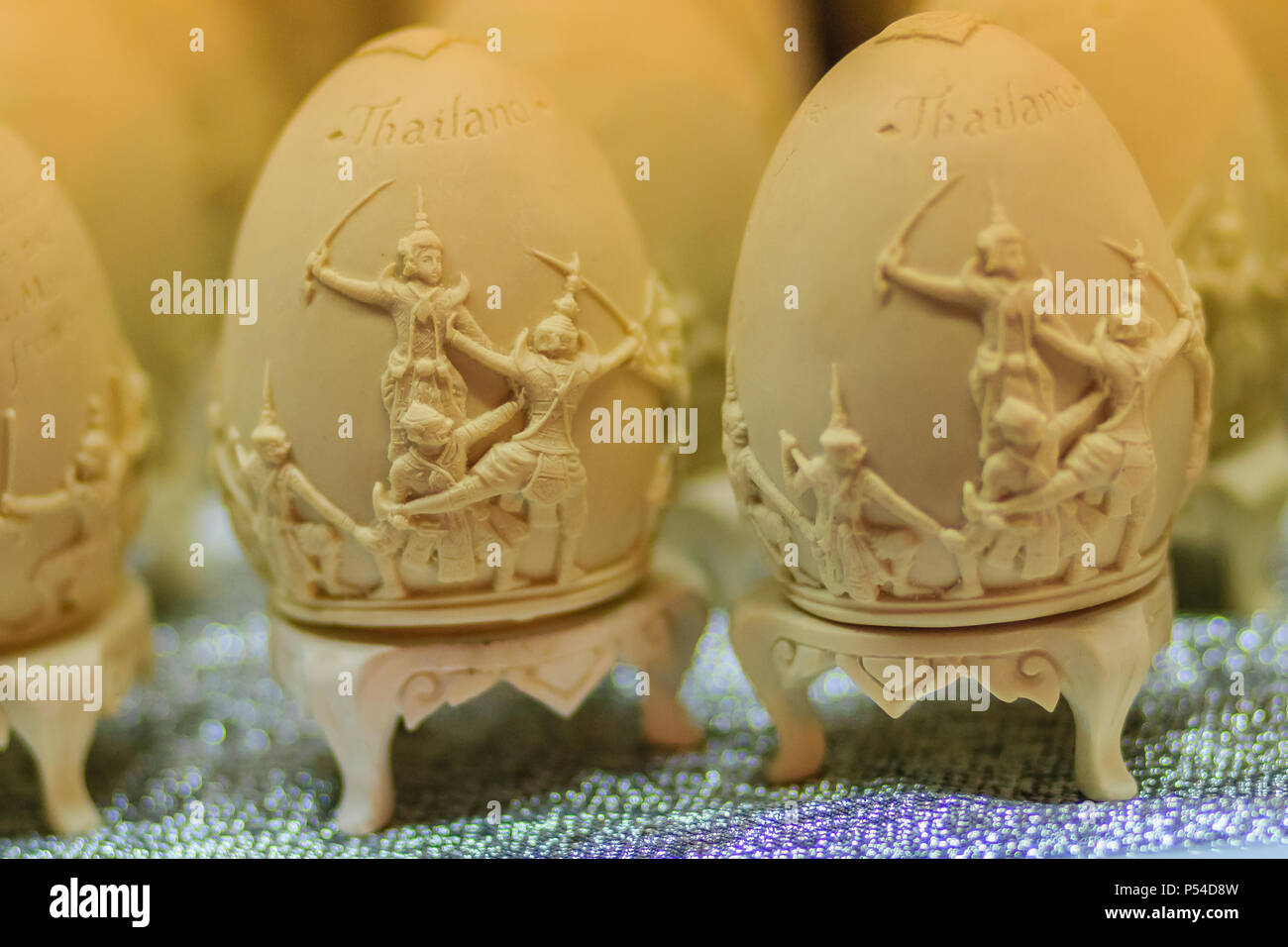 Beautiful Ester egg with Thai pattern. Handwriting inscription Happy Easter in Thai Style patterns. Stock Photo