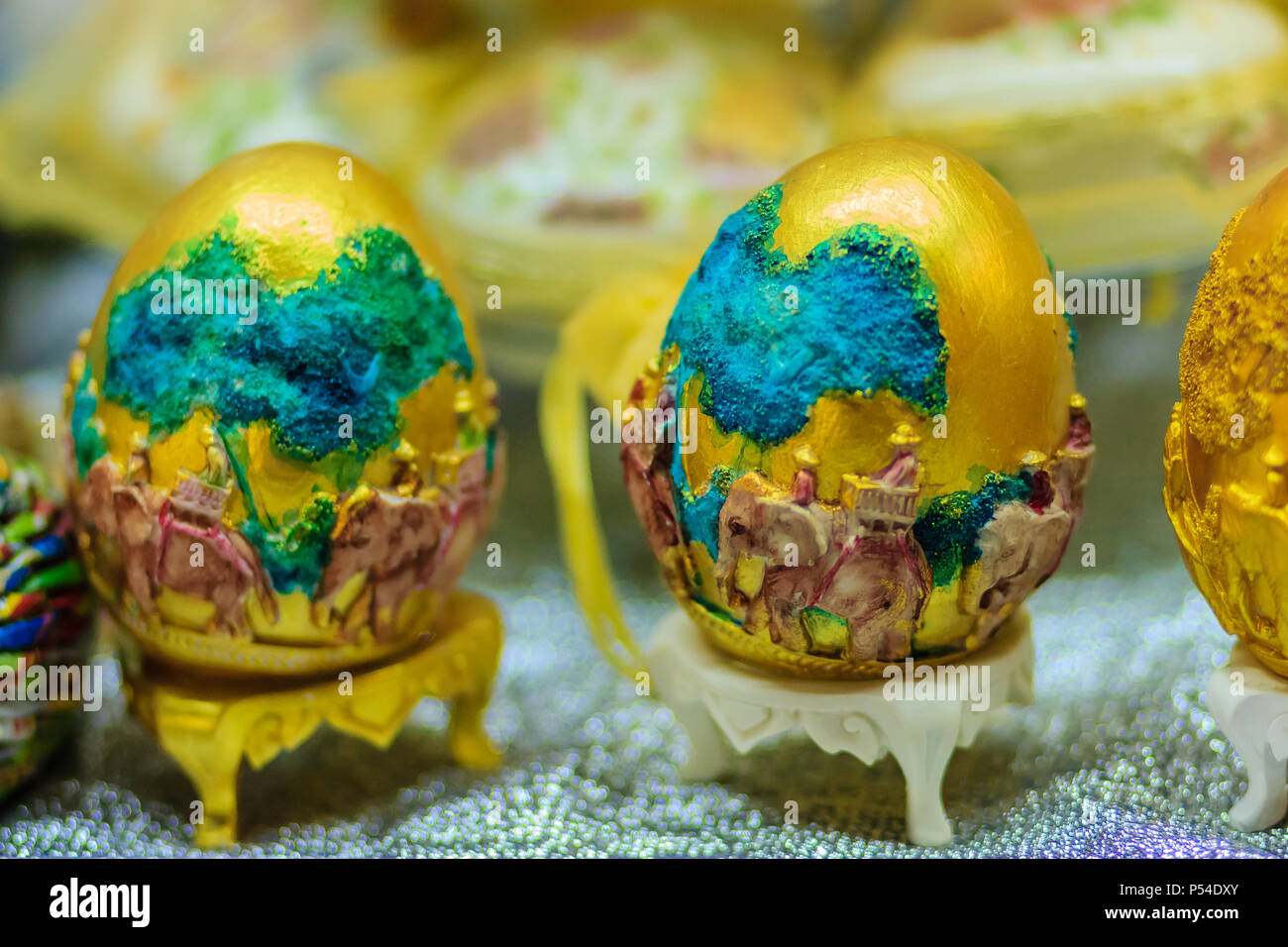 Beautiful Ester egg with Thai pattern. Handwriting inscription Happy Easter in Thai Style patterns. Stock Photo