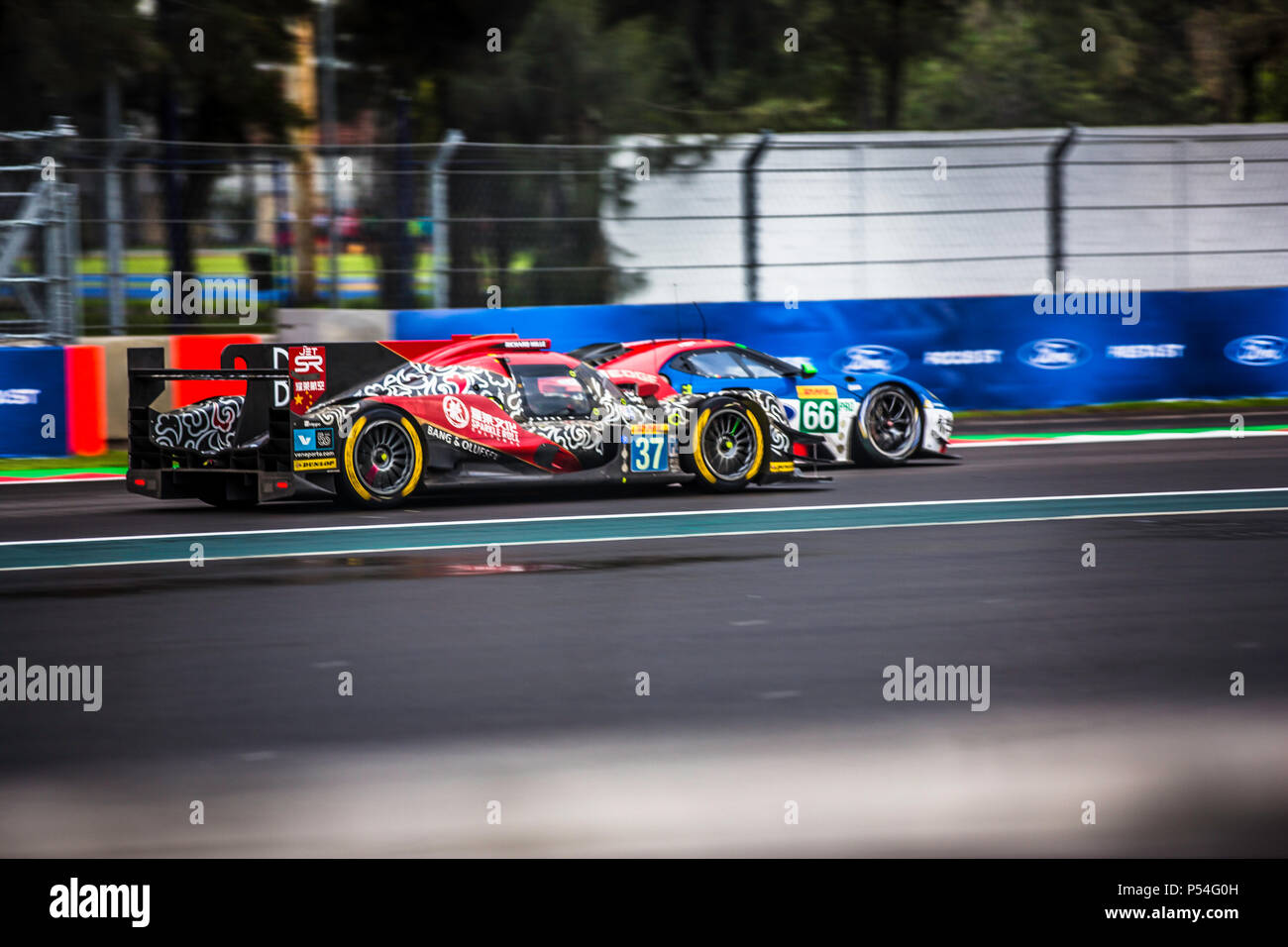 Mexico City, Mexico – September 01, 2017: Autodromo Hermanos Rodriguez. 6hrs of Mexico, FIA WEC. JACKIE CHAN DC RACING No. 37 leading in the first place of the LMP2 category, and FORD CHIP GANASSI TEAM UK No. 66, running hand by hand at the Free Practice I. Stock Photo