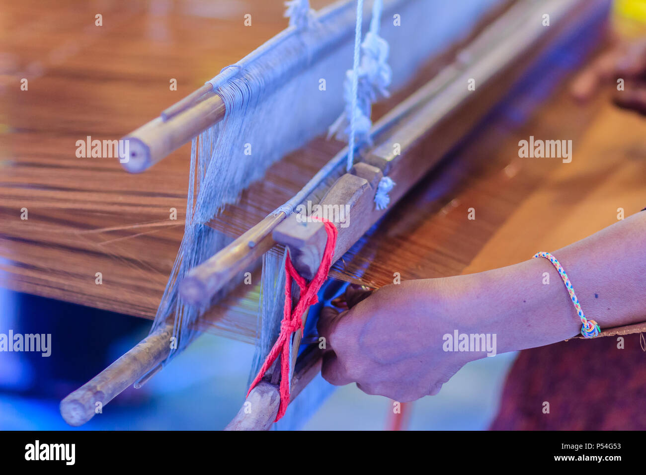Weaving on small hand loom hi-res stock photography and images - Alamy