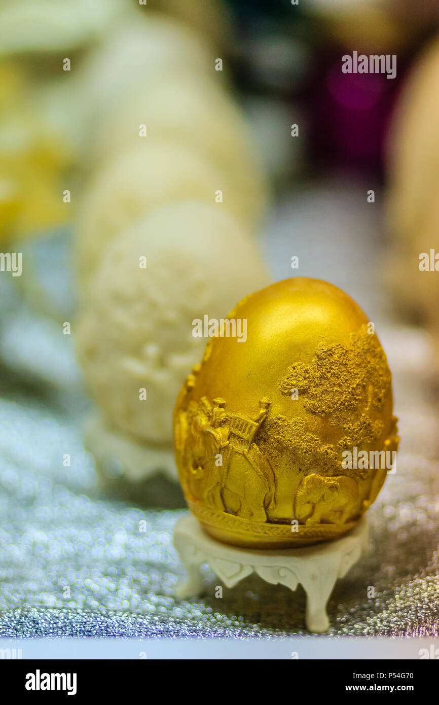 Beautiful Ester egg with Thai pattern. Handwriting inscription Happy Easter in Thai Style patterns. Stock Photo