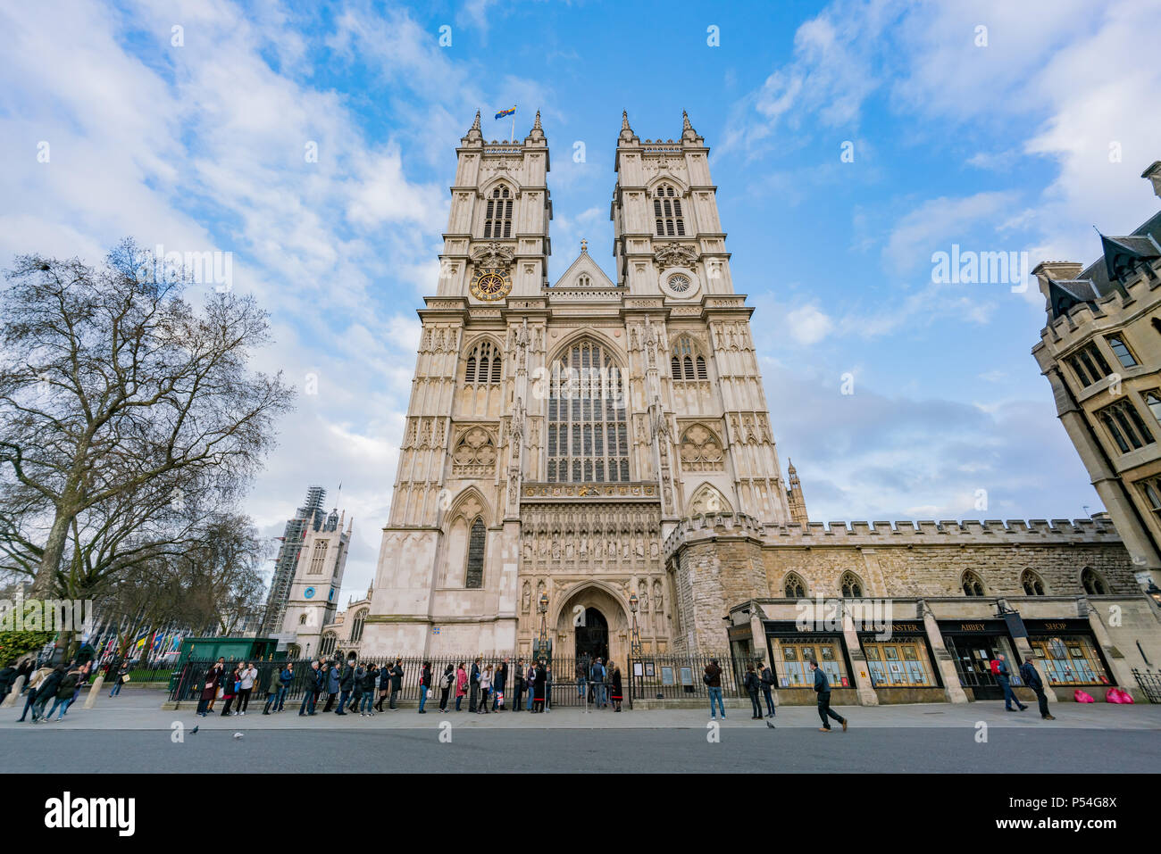 London, APR 15: Exterior view of the Westminster Abbey and long queueing line on APR 15, 2018 at London, United Kingdom Stock Photo