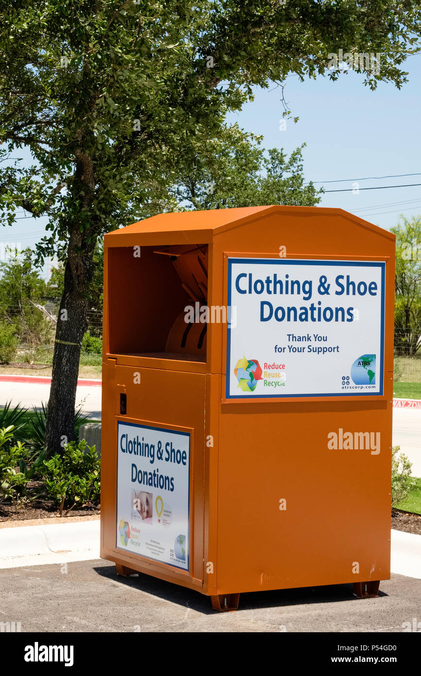 Bin for collection of clothing and shoe donations for community charity Stock Photo