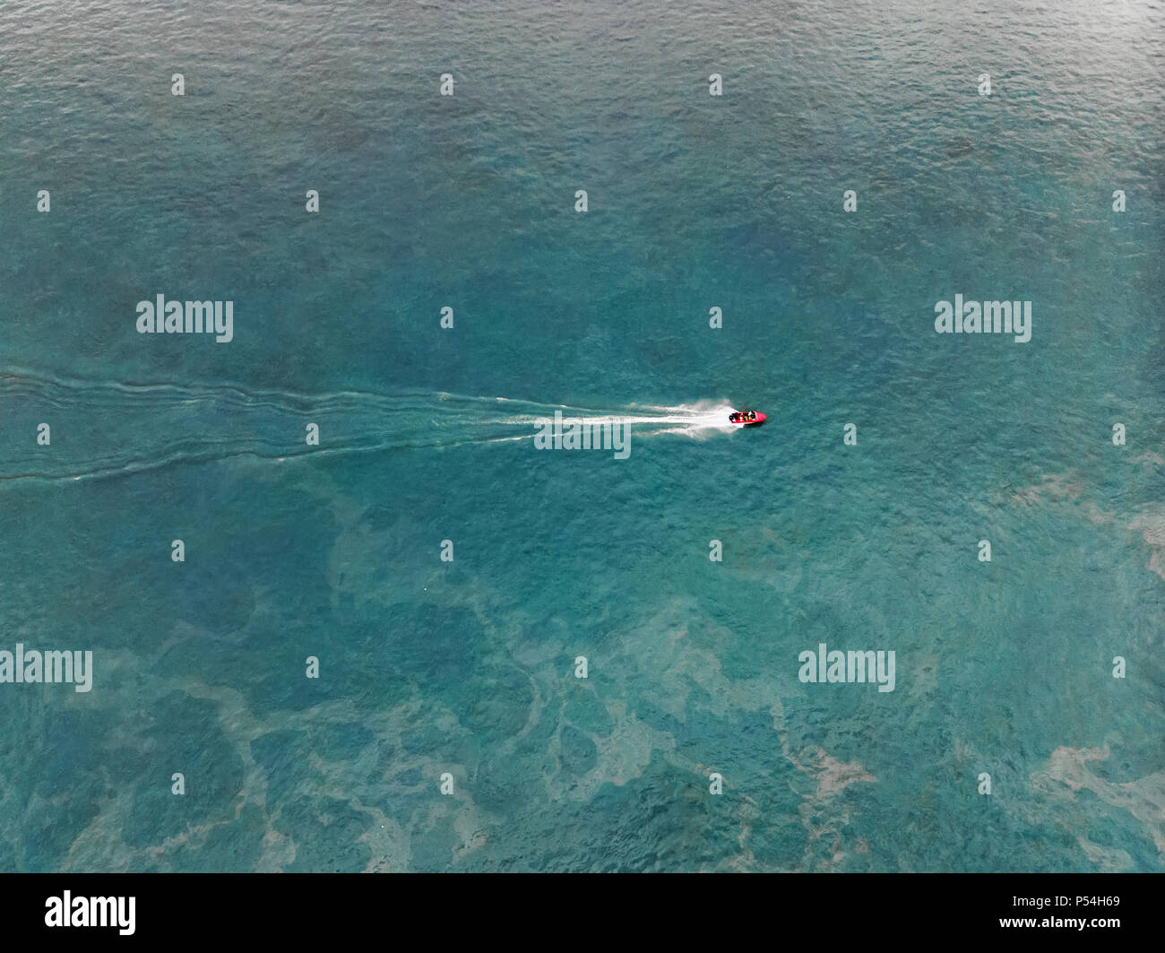 Top view of a white boat sailing in the blue sea Stock Photo - Alamy