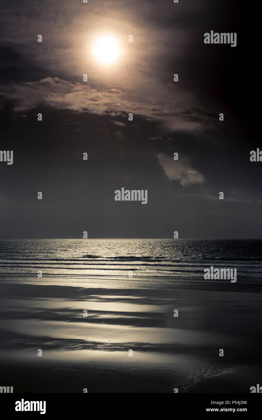 Sun over the sea at Newgale beach, Pembrokeshire, Wales Stock Photo