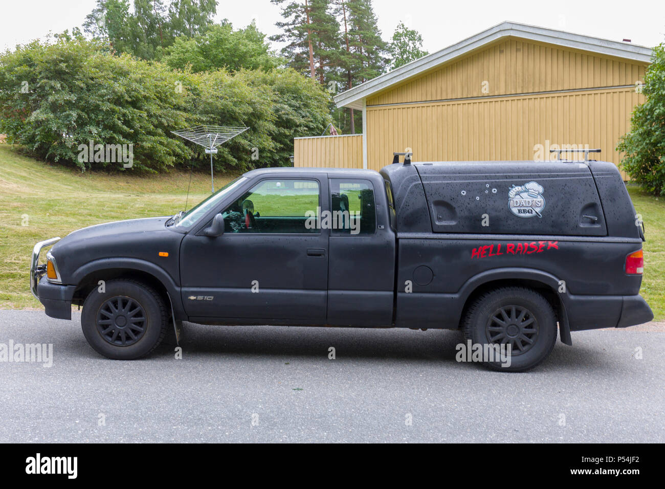 View of black custom pick up truck called Hellraiser and Dad's BBQ Stock Photo
