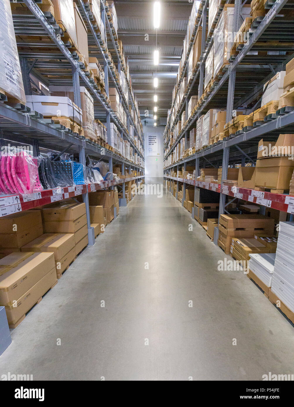 Interior View Of Aisles In A Large Warehouse Stacked With Cardboard ...