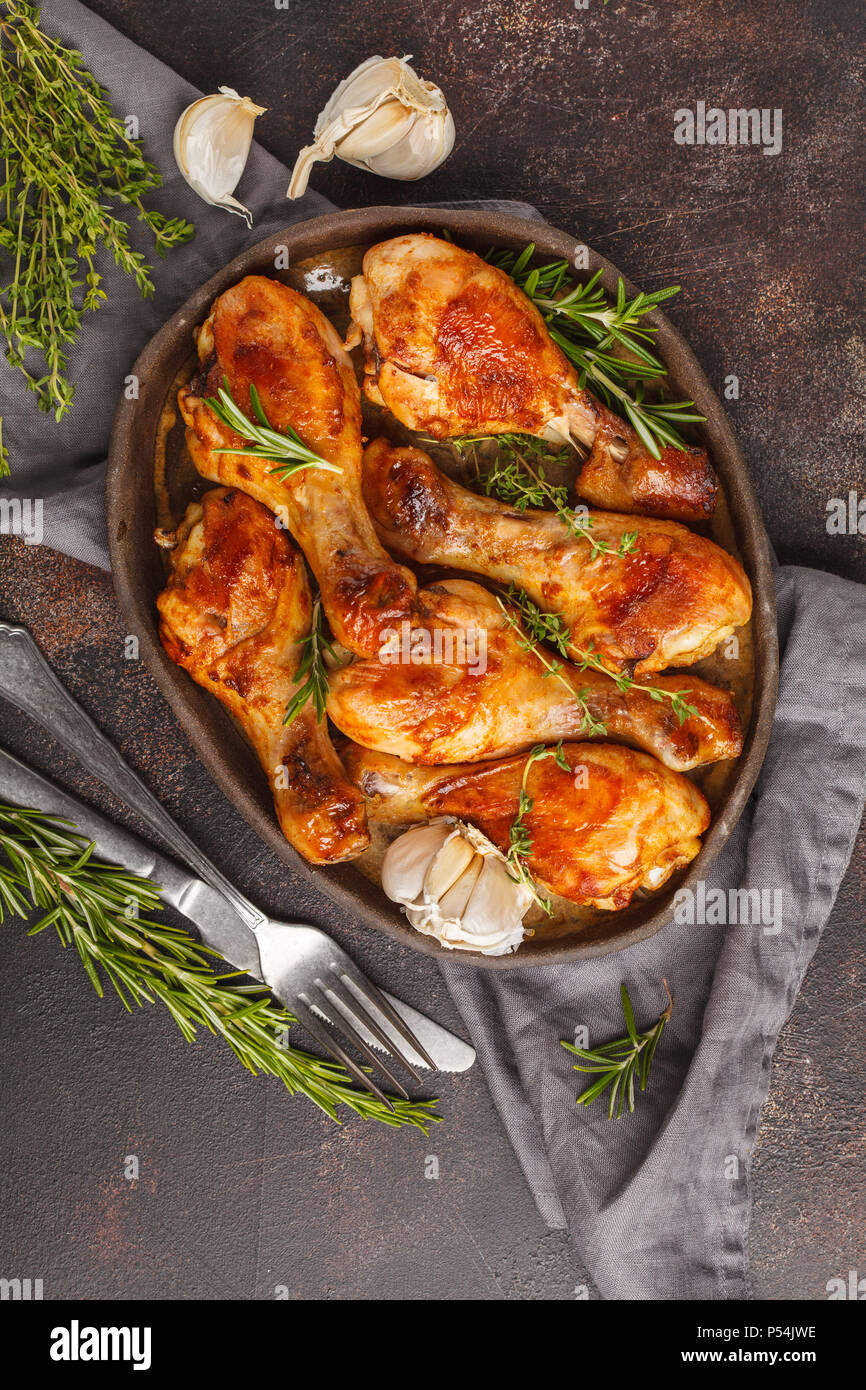 Grilled spicy chicken legs baked with garlic, rosemary and thyme on