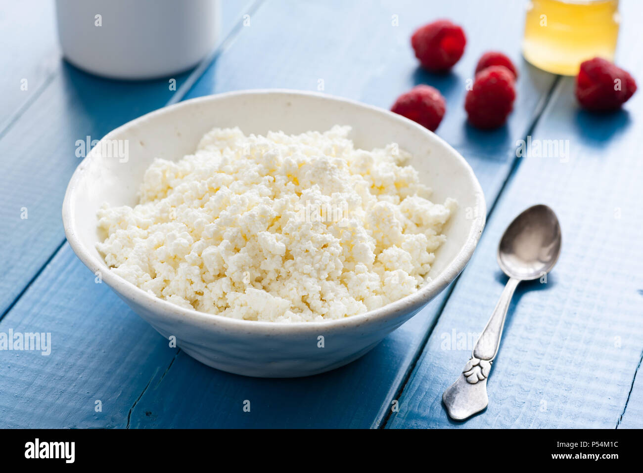Fresh cottage cheese or ricotta or tvorog or curd cheese in a bowl