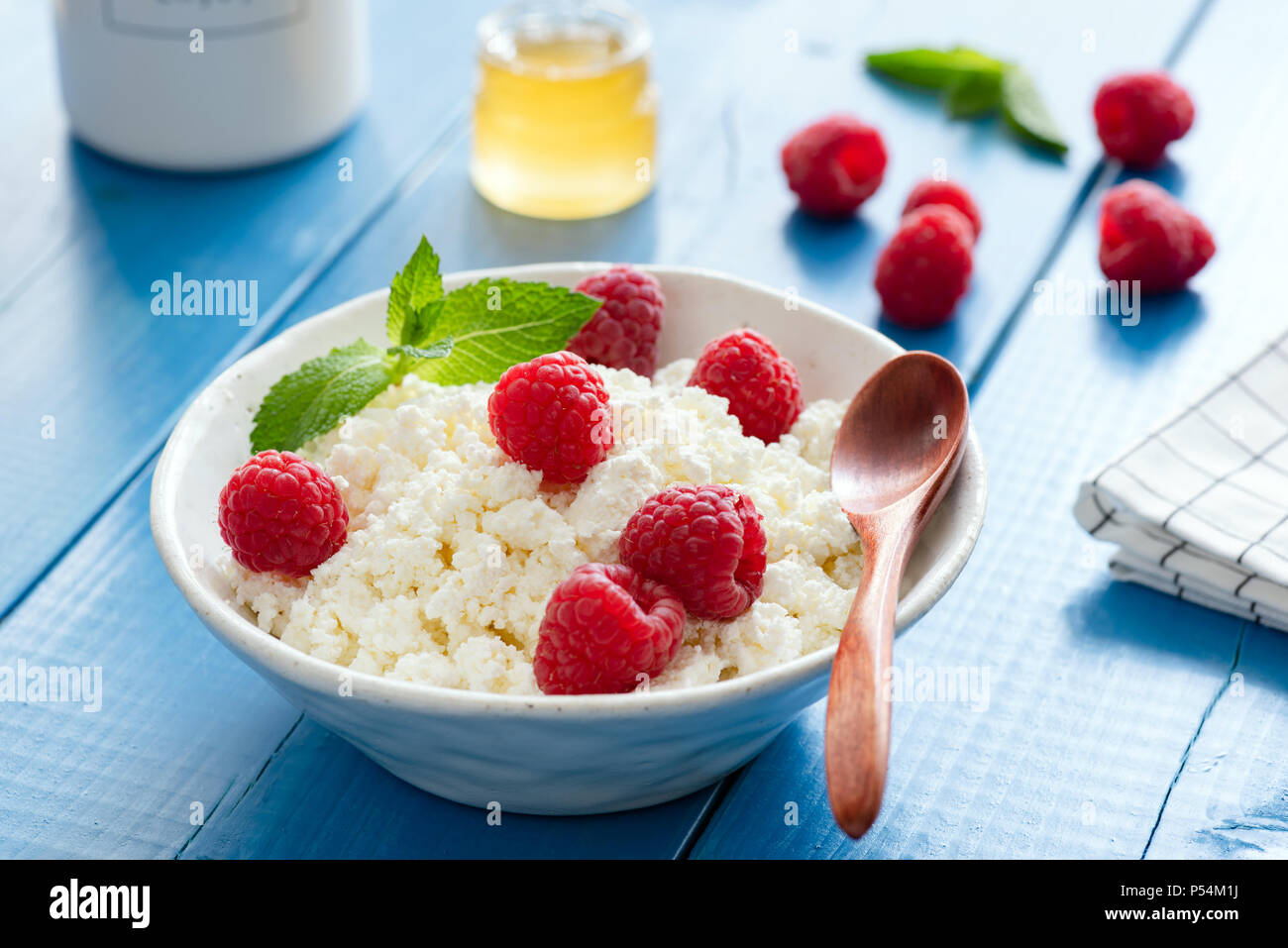 Ricotta Tvorog Or Cottage Cheese With Raspberries And Honey On