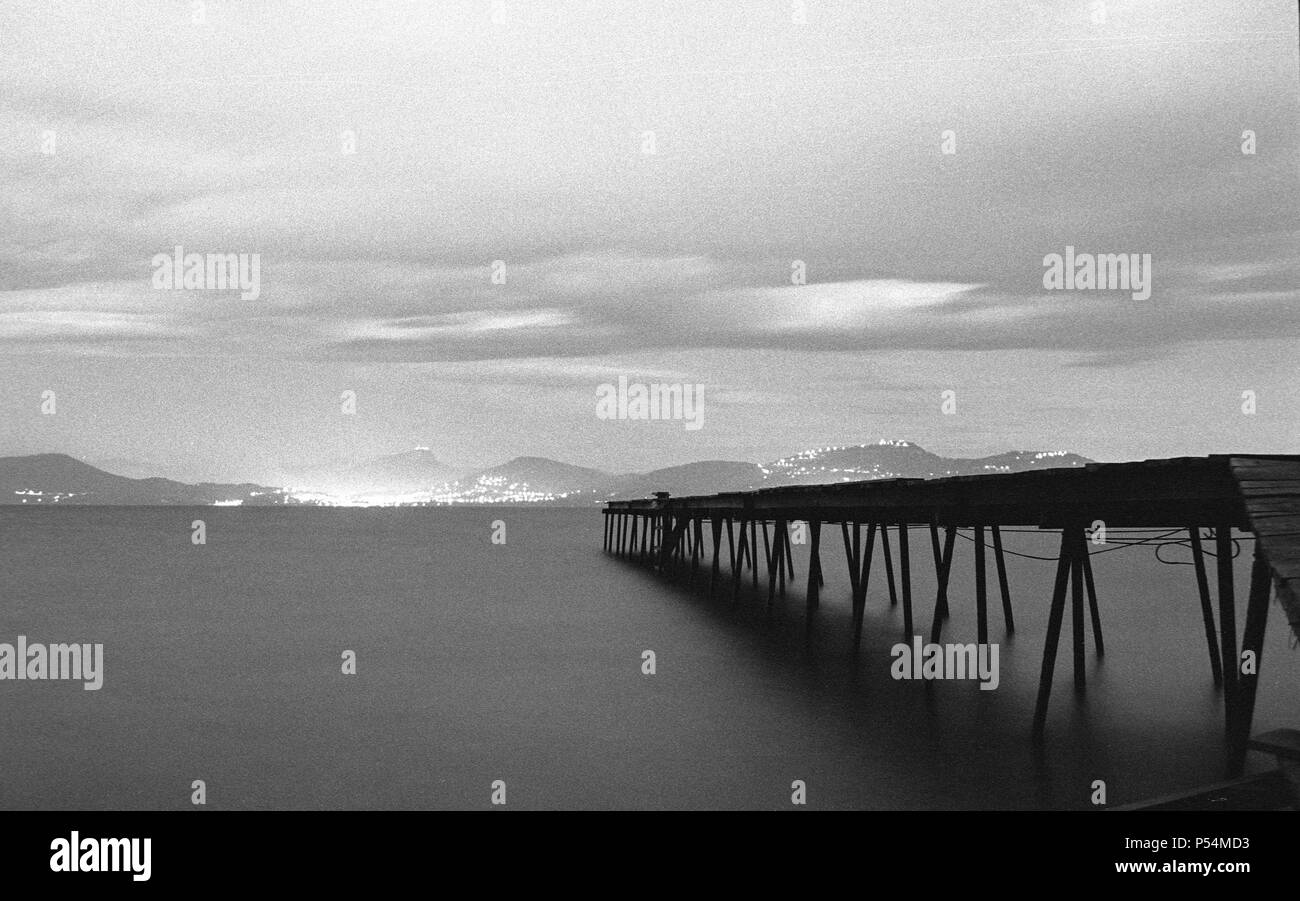 old pier, near Hyères/Giens South of France by night. Analog Picture. Stock Photo