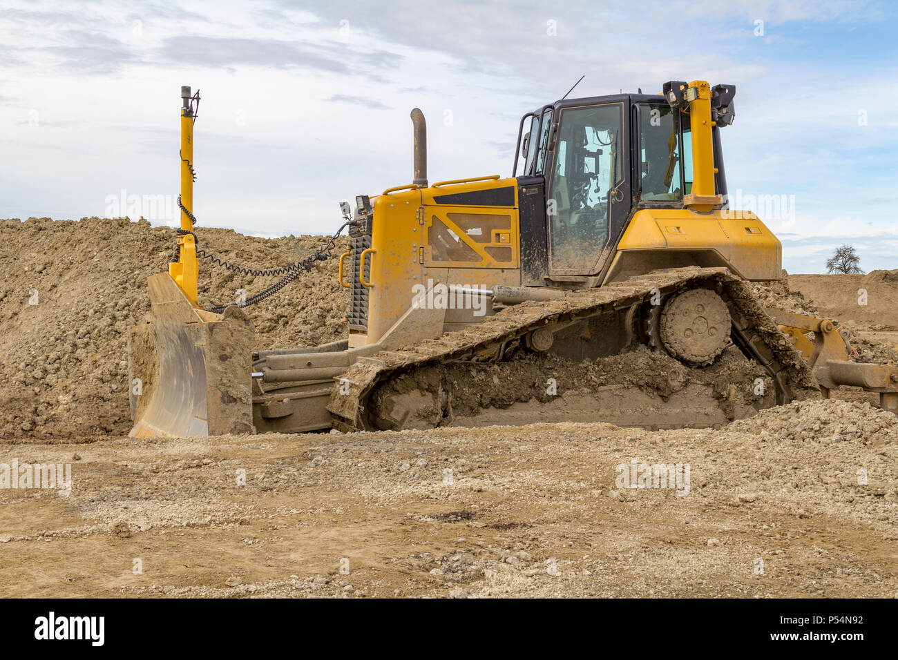 yellow bulldozer at a loamy construction site Stock Photo - Alamy