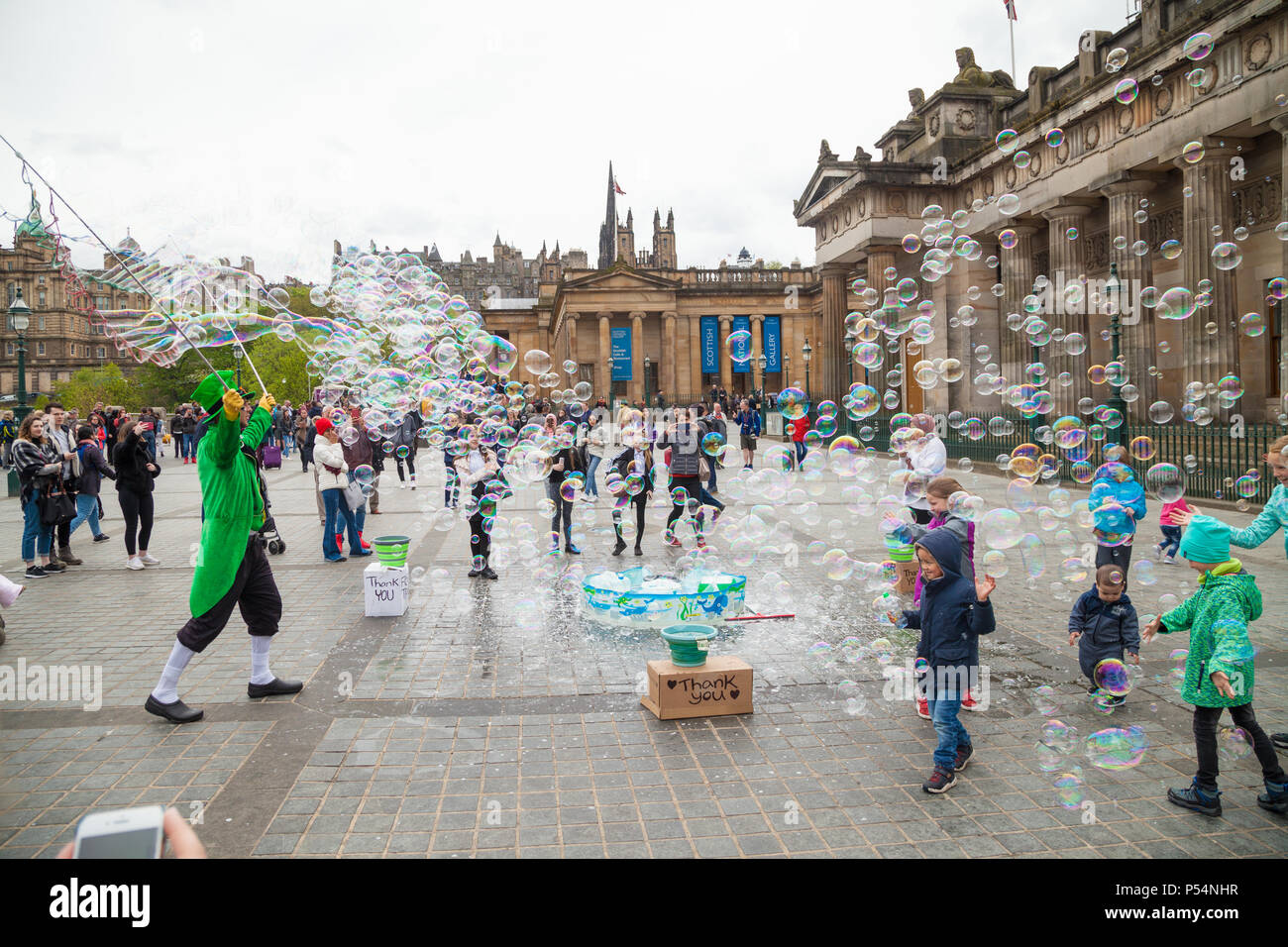 A street performer in Edinburgh creating masses of bubbles Stock Photo