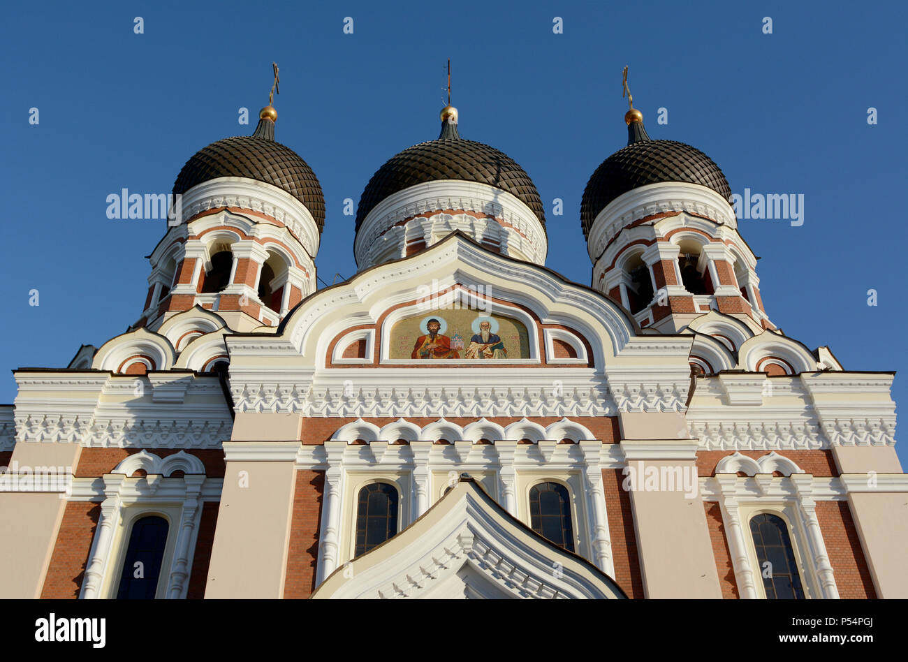 Exterior of Alexander Nevsky Cathedral in Tallinn, Estonia with ornate decoration and three of the building's five onion domes visible Stock Photo