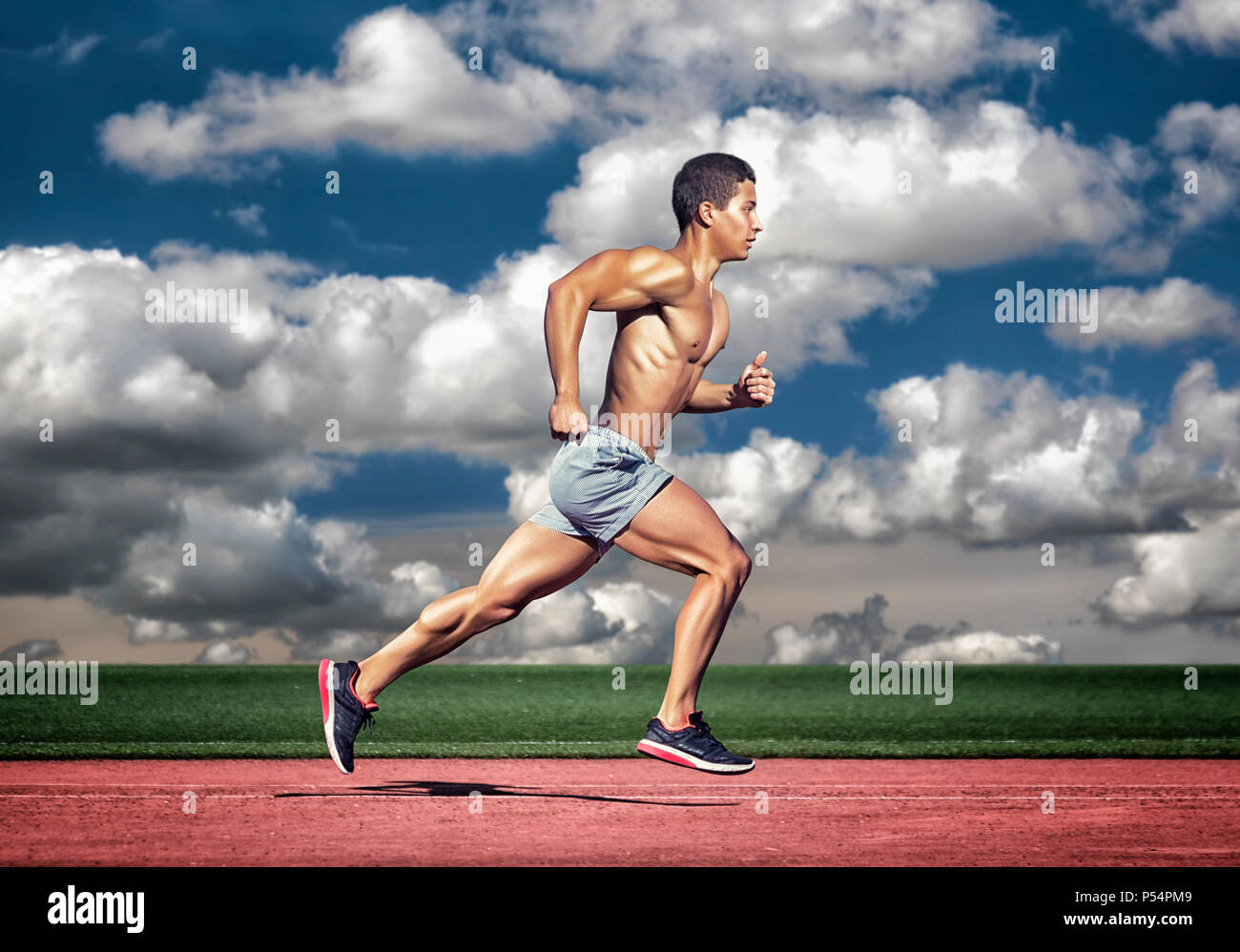 Muscular male runner running hi-res stock photography and images - Alamy