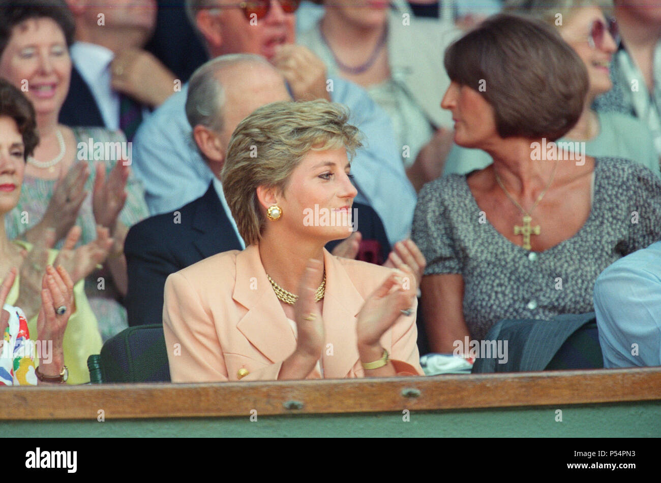 HRH The Princess of Wales, Princess Diana, attends the 1993 Men's Singles Wimbledon Tennis Final.   In other frames in this set, The Princess is shown sitting next to her mother Frances Shand Kydd.  Regarding the match, Pete Sampras defeated Jim Courier 7 – 6, 7 - 6, 3 – 6, 6 –3 in the final to win the Gentlemen's Singles title at the 1993 Wimbledon Championships. This was the first of Pete's Open Era record of seven Wimbledon titles.  Picture taken 4th July 1993 Stock Photo