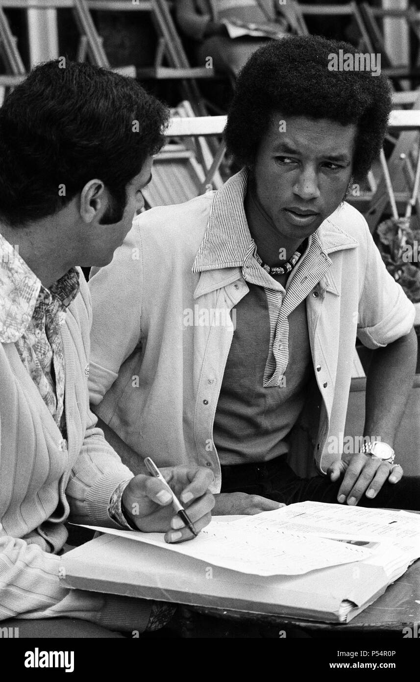 Top players at the Queen's Club Tournament at Queen's Club, Kensington. Arthur Ashe discusses the boycott with Paola Angeli (Italian rep of the I.L.T.F).  21st June 1973. Stock Photo
