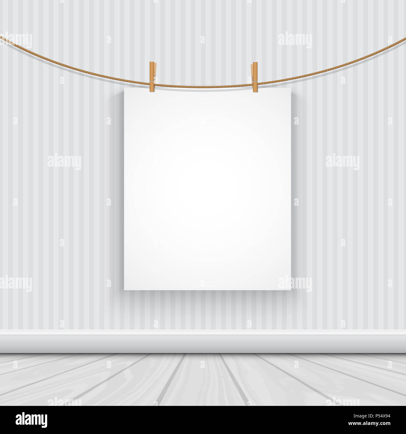 Blank picture hanging from a rope in a minimalist room Stock Photo