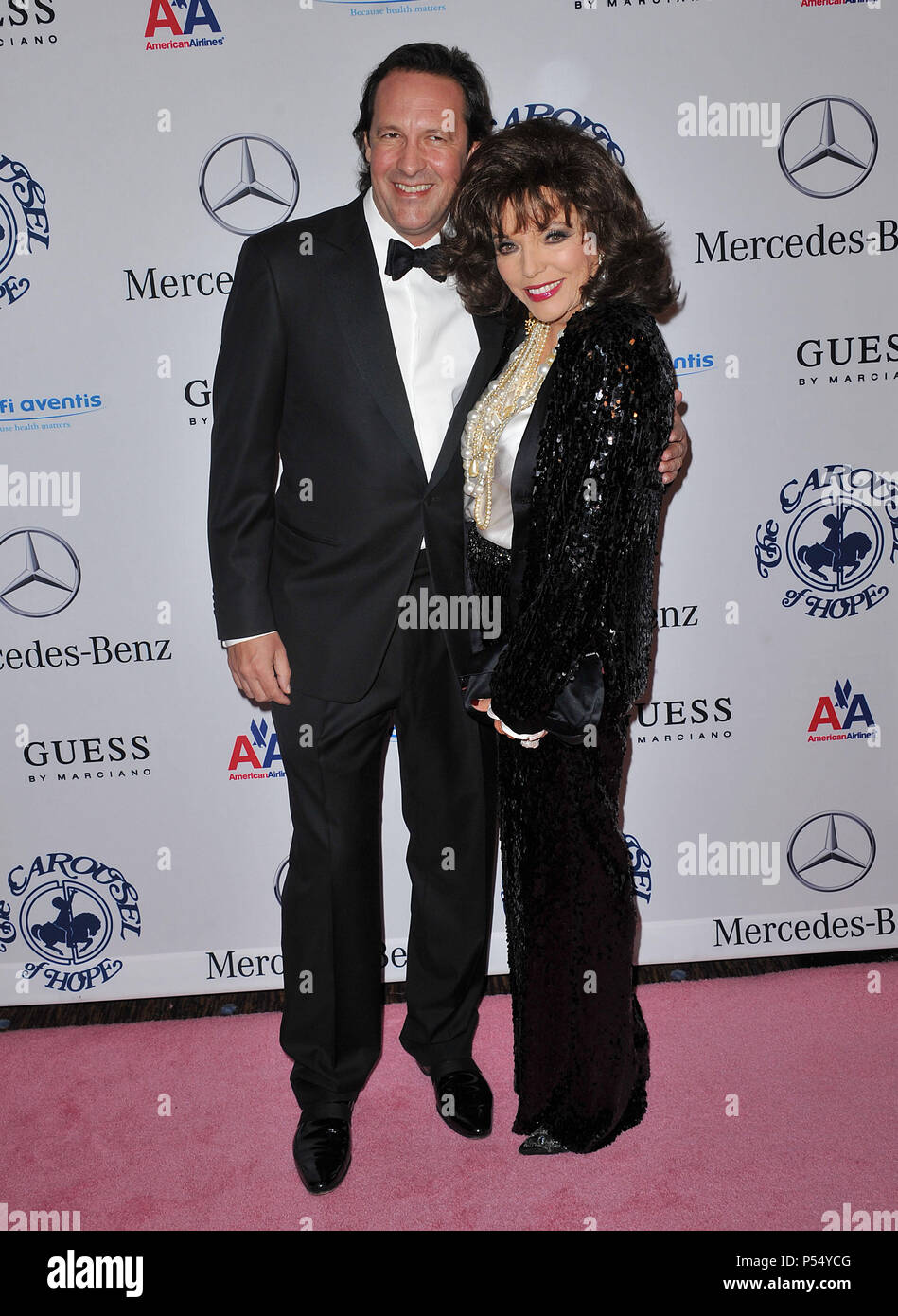 Joan Collins and husband   - Carousel Of Hope at the Beverly Hilton Hotel In LosAngeles.Joan Collins, husband 26  Event in Hollywood Life - California, Red Carpet Event, USA, Film Industry, Celebrities, Photography, Bestof, Arts Culture and Entertainment, Celebrities fashion, Best of, Hollywood Life, Event in Hollywood Life - California, Red Carpet and backstage, Music celebrities, Topix, Couple, family ( husband and wife ) and kids- Children, brothers and sisters inquiry tsuni@Gamma-USA.com, Credit Tsuni / USA, 2010 Stock Photo
