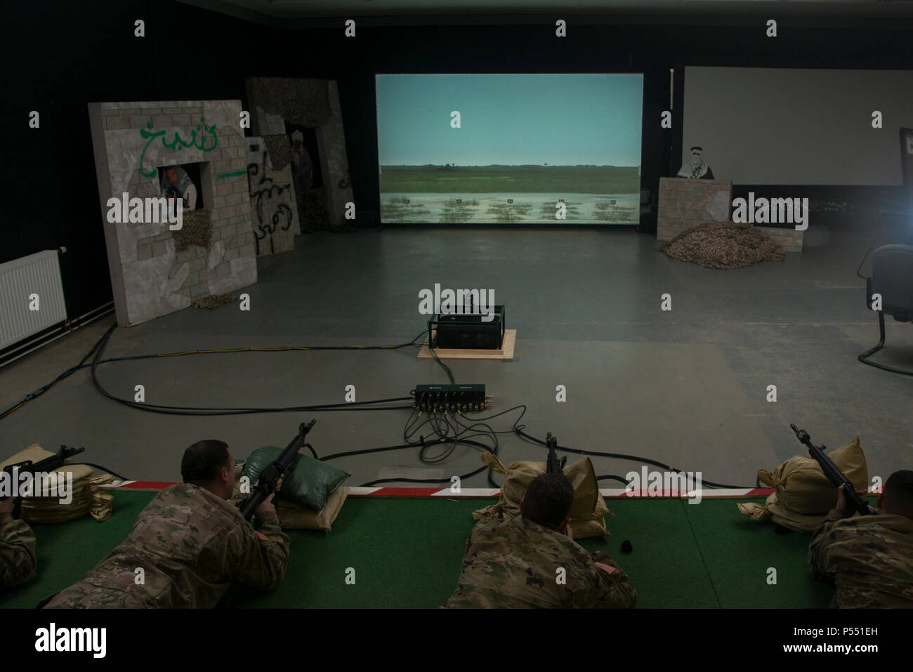 U.S. Soldiers train using the Engagement Skills Trainer II, EST II, at ...