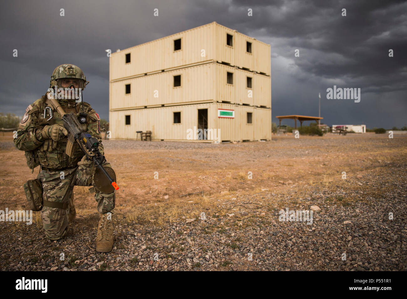 A Peruvian Air Force security forces Airman provides perimeter security during an isolated personnel scenario for exercise Angel Thunder 17 in Florence, Ariz., May 9, 2017. Angel Thunder is a two-week, Air Combat Command-sponsored, joint certified and accredited personnel recovery exercise focused on search and rescue. The exercise is designed to provide training for personnel recovery assets using a variety of scenarios to simulate deployment conditions and contingencies. Stock Photo