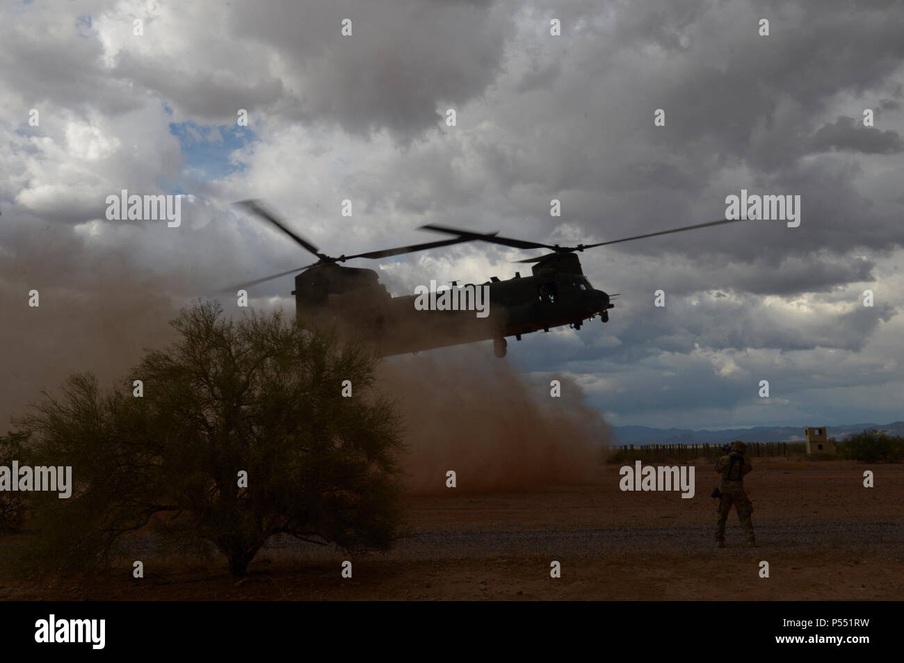 A CH-47 Chinook lands during a personnel recovery scenario at Angel Thunder 17 in Florence, Ariz., May 9, 2017. Angel Thunder is a two-week, Air Combat Command-sponsored, joint certified and accredited personnel recovery exercise focused on combat search and rescue. The exercise designed to provide training for personnel recovery assets using a variety of scenarios to simulate deployment conditions and contingencies. Stock Photo