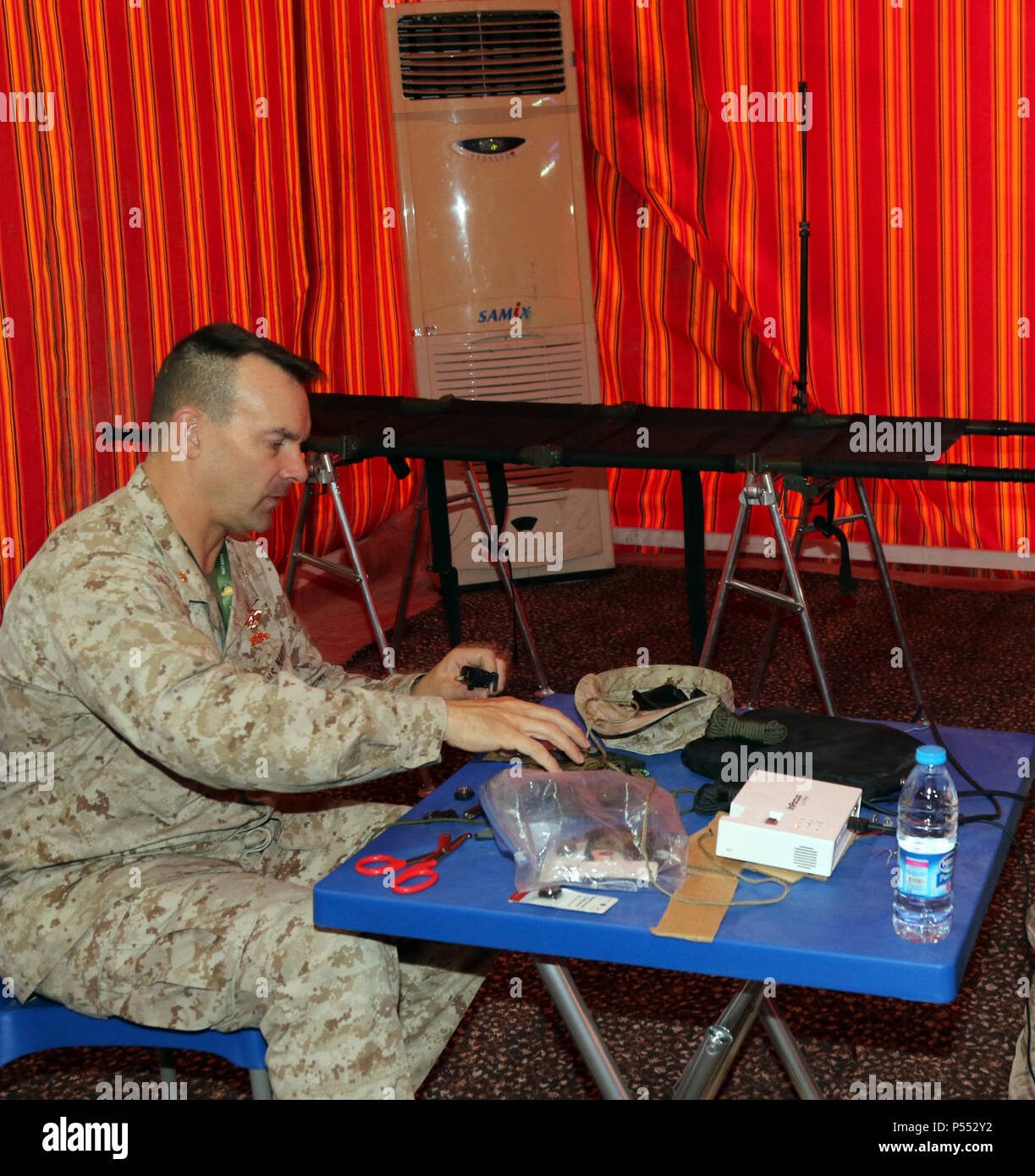 Lt. Cmdr. James Hartwell, an emergency physician with the Naval Hospital at Camp Pendleton, Calif., assembles supplies before the start of the workday May 9, during exercise Eager Lion at the Joint Training Center in Jordan. Eager Lion 2017 is an annual U.S. Central Command exercise in Jordan designed to strengthen military-to-military relationships between the U.S., Jordan and other international partners. This year’s iteration is comprised of about 7,200 military personnel from more than 20 nations that will respond to scenarios involving border security, command and control, cyber defense a Stock Photo