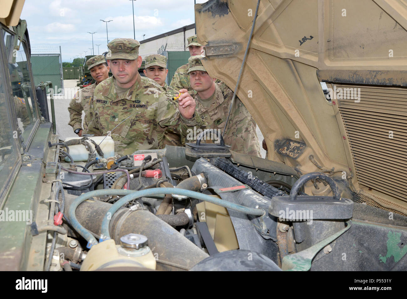 U.S. Army Paratroopers assigned to the 173rd Airborne Brigade Support Battalion, 173rd Airborne Brigade, are tested on their procedures conducting Preventive Maintenance Checks and Service of military vehicles during the Junior Leader Challenge at Caserma Del Din, Vicenza, Italy May 10, 2017.  The 173rd Airborne Brigade is the U.S. Army Contingency Response Force in Europe, capable of projecting ready forces anywhere in the U.S. European, Africa or Central Commands areas of responsibility within 18 hours. Stock Photo