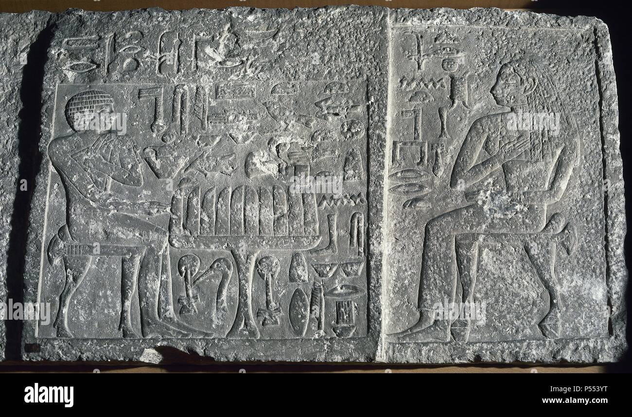 Relief depicting the deceased Itjer sitting at the table of offerings with his consort. The hieroglyph shows the list of offerings numbered in quantities of a thousand. Giza Necropolis. 4th Dynasty. 2600 BC. Egyptian Museum. Turin. Italy. Stock Photo