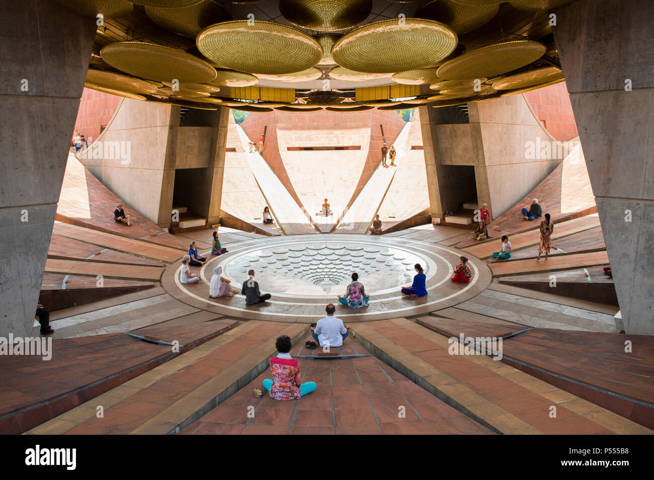 AUROVILLE, INDIA. Meditation at the lotus pond underneath the ...