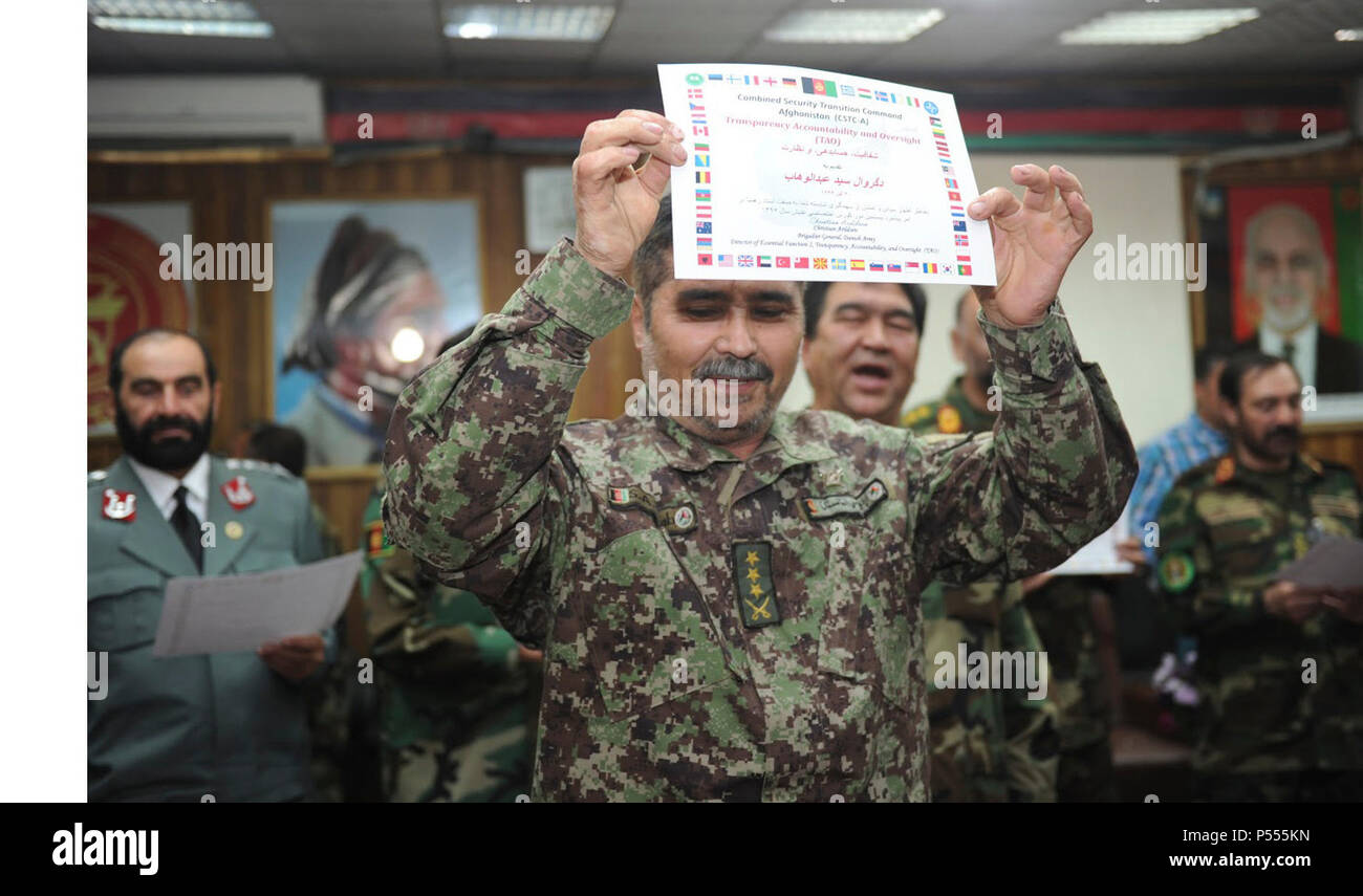 KABUL, Afghanistan (May 27, 2017) — A graduated student of the newest inspectors general class shows his certificate of graduation. The Ministry of Defense graduated its newest class of inspectors general here empowered to conduct inspections at all levels of the Afghan military to eradicate corruption and instill accountability. Stock Photo