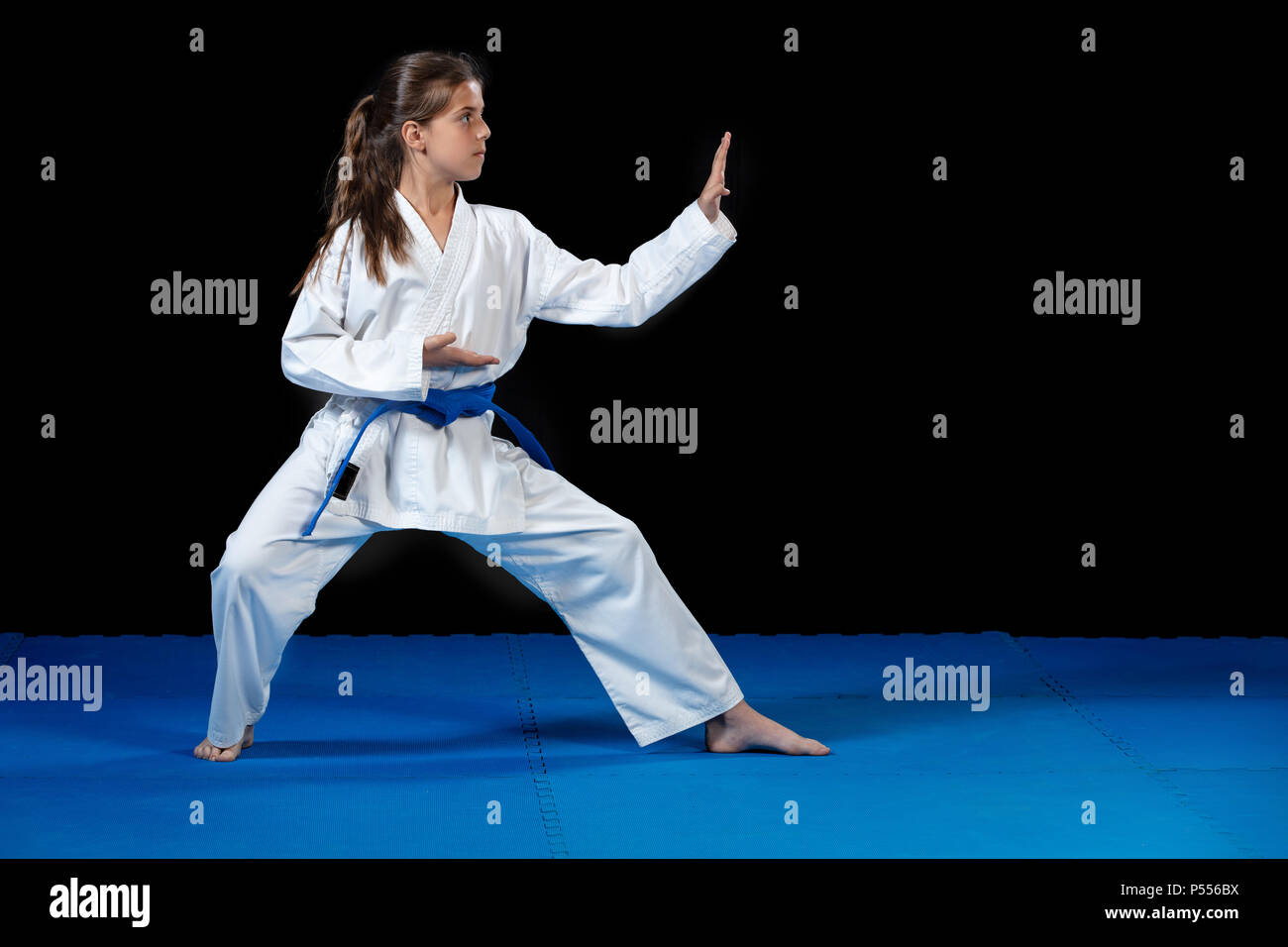 young girl in a white kimono, karate Stock Photo