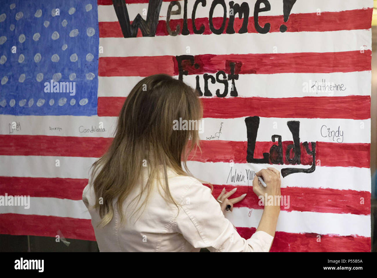 McAllen, Texas. WEEK OF JUNE 18 First Lady Melania Trump signs a flag