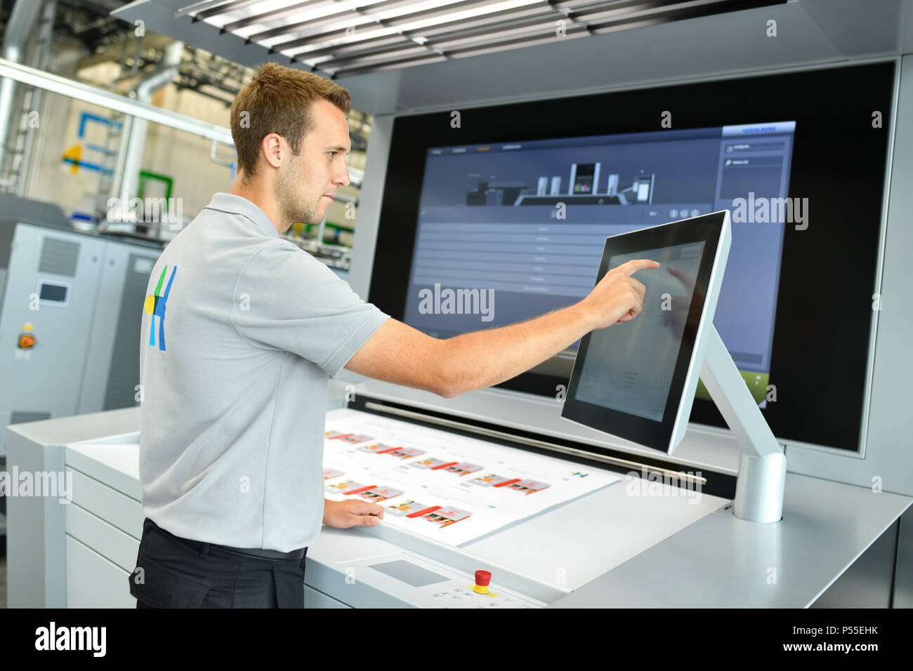 Wiesloch, Germany. 08th June, 2018. An employee operating the control unit  a digital printing machine of the type "Primefire 106" in the workshop of  Heidelberger Druckmaschinen AG ('Heidelberg printing machines'). The company