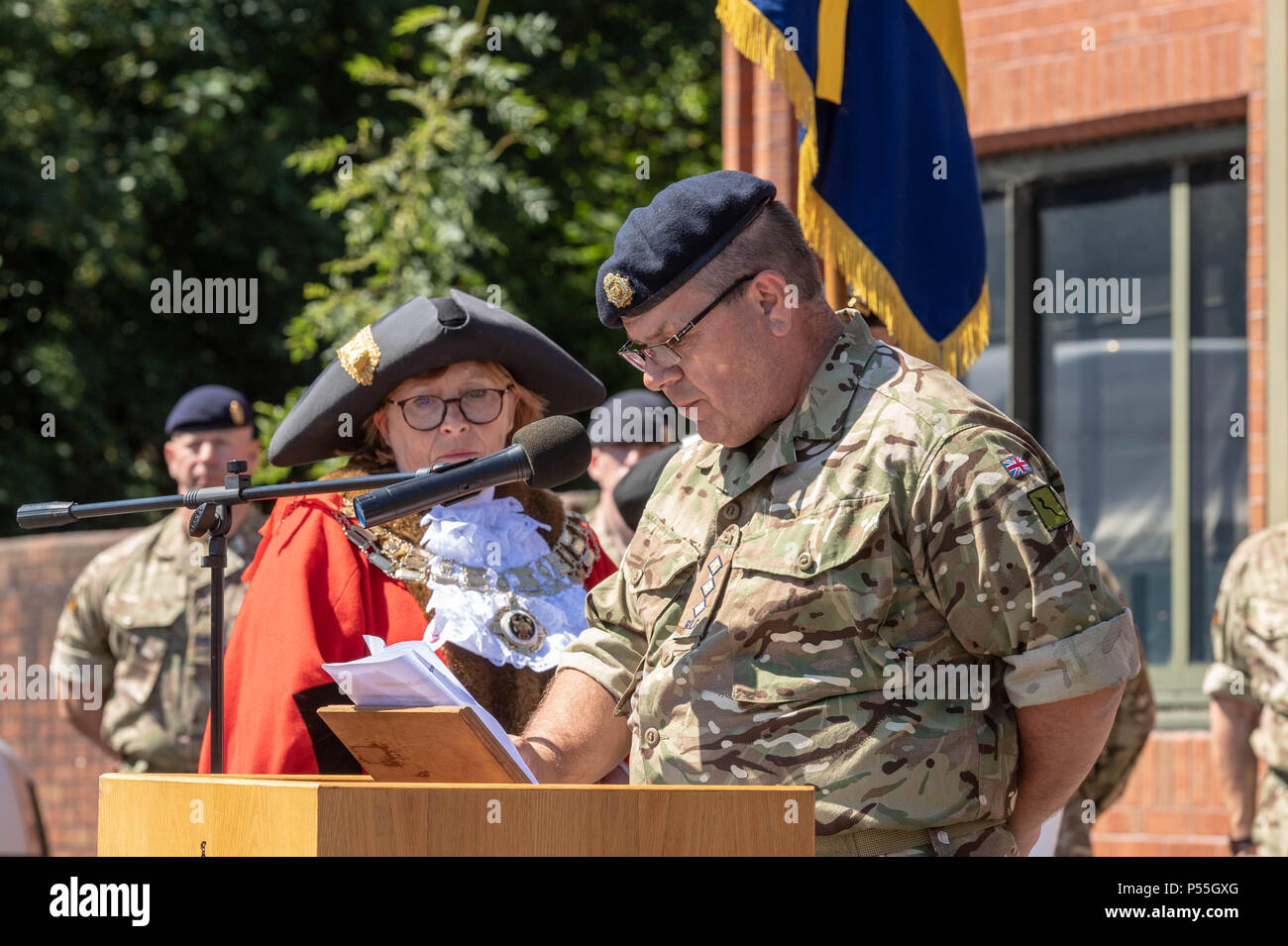 Brentwood, Essex, UK. 25th June 2018 Armed Forces Day Flag Raising at Brentwood, Essex. Captin Nick Allson, 124 Essex transport Squadron, reads a poem seen with the Mayor of Brentwood, Councillor Sheila MurphyCredit Ian Davidson/Alamy Live News Stock Photo