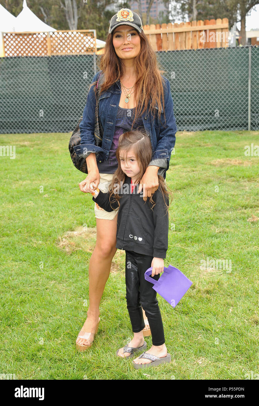 Tia Carrere, daughter  at the Pediatric Aid Foundation 2011 at the Wadsworth Theatre In Los Angeles.Tia Carrere, daughter  41 ------------- Red Carpet Event, Vertical, USA, Film Industry, Celebrities,  Photography, Bestof, Arts Culture and Entertainment, Topix Celebrities fashion /  Vertical, Best of, Event in Hollywood Life - California,  Red Carpet and backstage, USA, Film Industry, Celebrities,  movie celebrities, TV celebrities, Music celebrities, Photography, Bestof, Arts Culture and Entertainment,  Topix, vertical,  family from from the year , 2011, inquiry tsuni@Gamma-USA.com Husband an Stock Photo