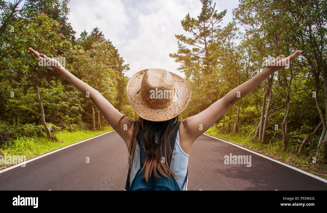 Happy travel woman on vacation concept. Funny traveler enjoy her trip and ready to adventure Stock Photo