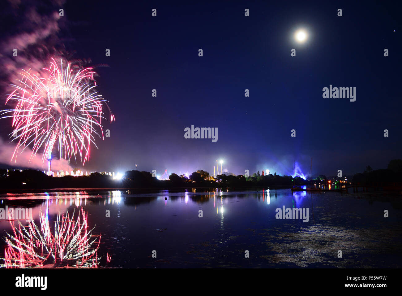 Newport, Isle of Wight, UK. Fireworks and a near full moon herald the