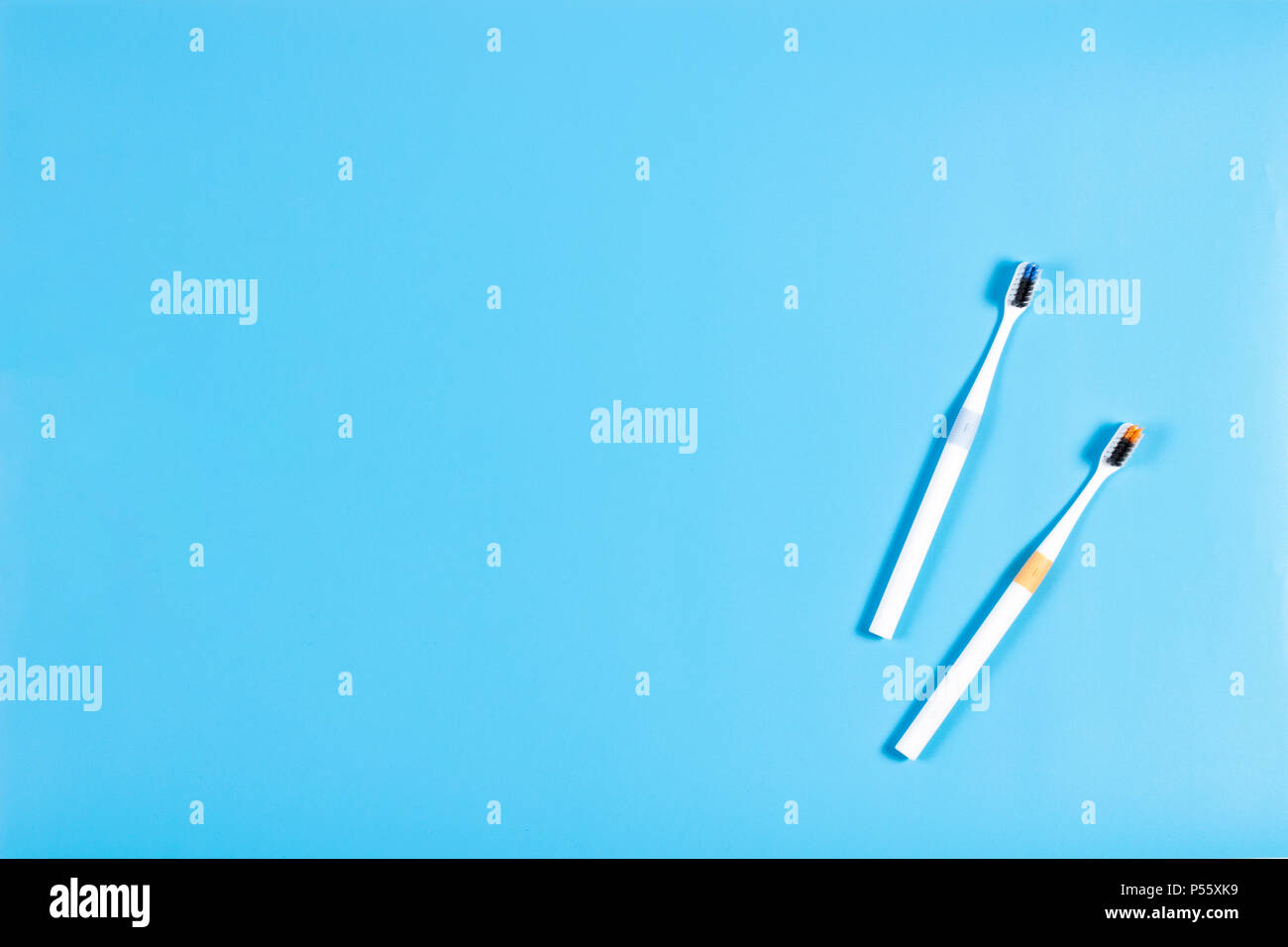 Toothbrushes on blue background. Top view Stock Photo - Alamy