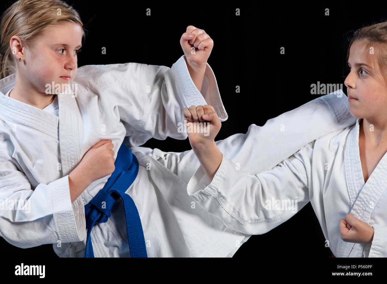 Karate martial Arts Two little girls demonstrate martial arts working together Stock Photo Alamy