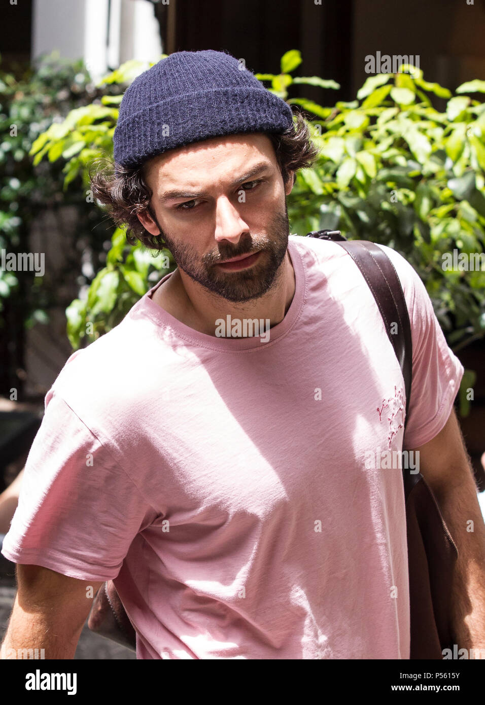 Aiden Turner actor best-known for his role in the BBC series ’Poldark’ arriving at Noel Coward theatre where he's starring in 'The Lieutenant of Inis' Stock Photo