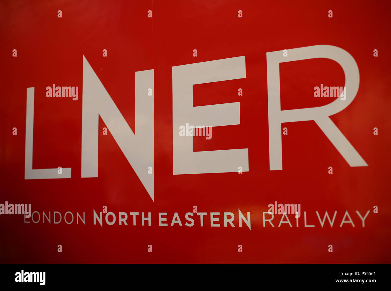 The logo for the London North Eastern Railway (LNER) painted on the side of a train during the launch event for the new service, which replaces the failed rail franchise Virgin Trains East Coast (VTEC), at Kings Cross station in London. Stock Photo