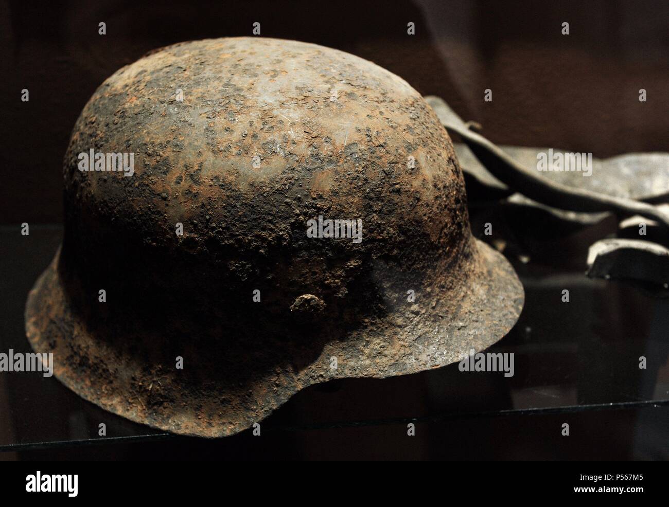History. World War II. Latvia.  Helmet found in the field of Battle near and More. Over 200 Latvians died between September 26 to 29, 1944. The Division Latvian Legion 19 or 19th Waffen SS Grenadier Division stopped the Red Army's advance towards Riga. The objects were excavated between 1994 and 1997. Occupation Museum. Riga. Latvia. Stock Photo
